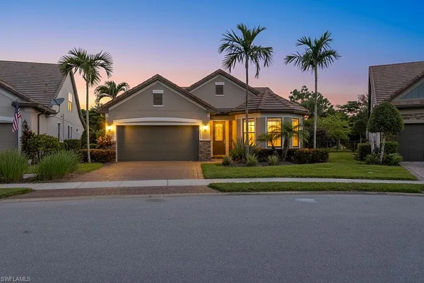 a front view of house with yard and green space
