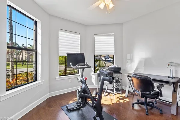 a view of a livingroom with furniture and a window