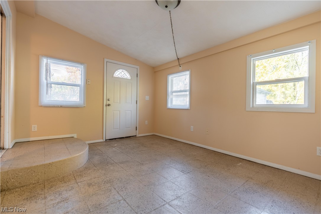337 Yager Road Clinton, OH 44216 - Photo 34 of 34 Entryway / 4-season room featuring vaulted ceiling and light tile floors