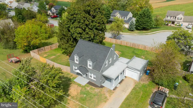 an aerial view of residential houses with outdoor space