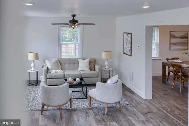 a living room with furniture and a window
