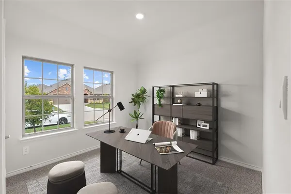 a living room with furniture a window and a table