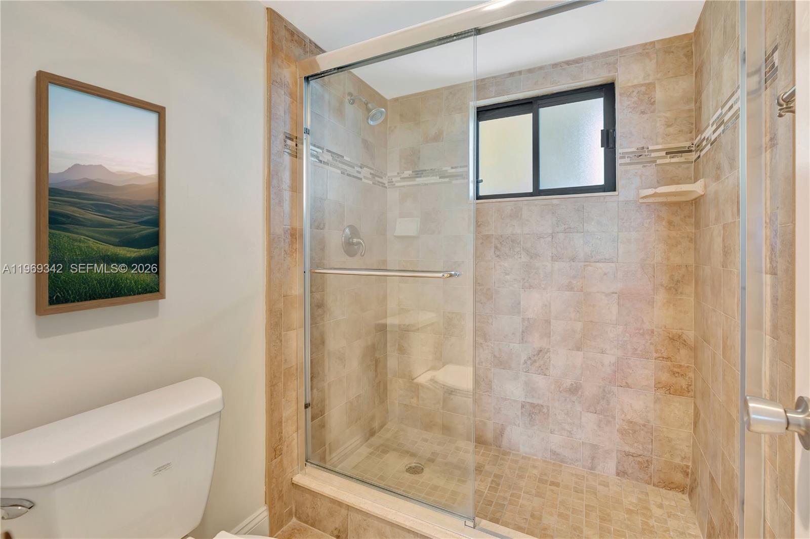 300 Ocean Trail Way, Unit 1008 Jupiter, FL 33477 - Photo 12 of 34 a bathroom with a shower and toilet