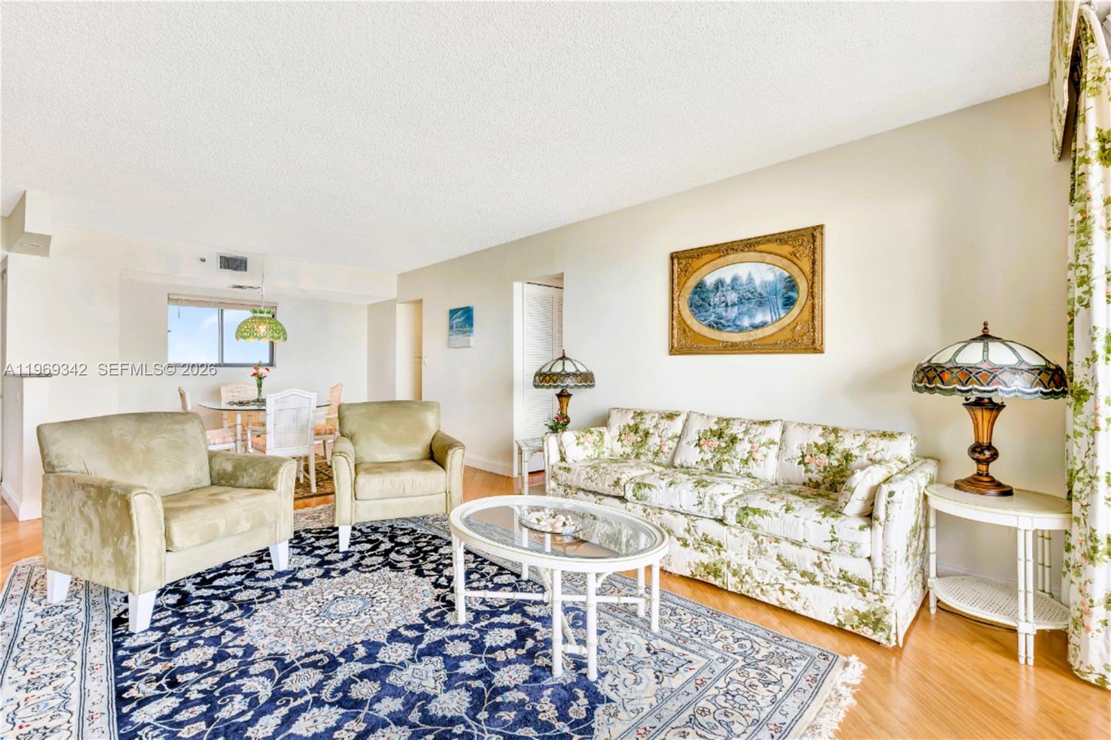 300 Ocean Trail Way, Unit 1008 Jupiter, FL 33477 - Photo 18 of 34 a living room with furniture and a table