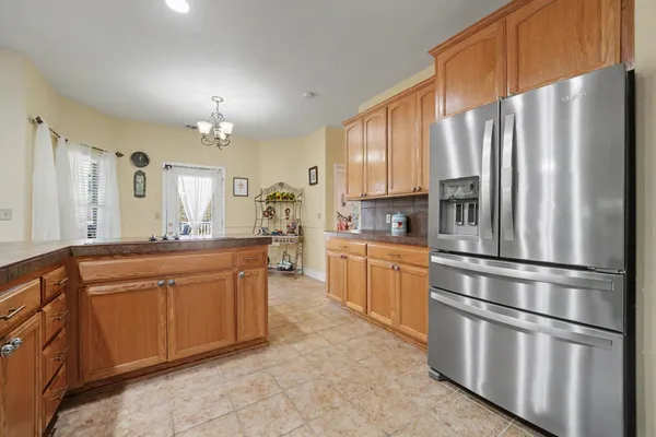 a view of balcony with furniture and umbrella