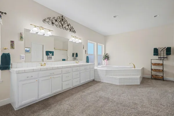 a bedroom with a bed and a table