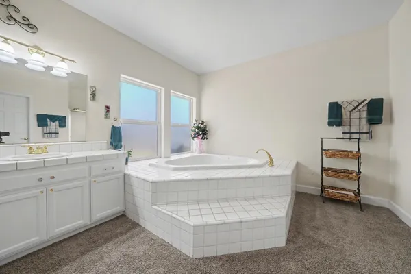 a view of a livingroom with workspace and a window