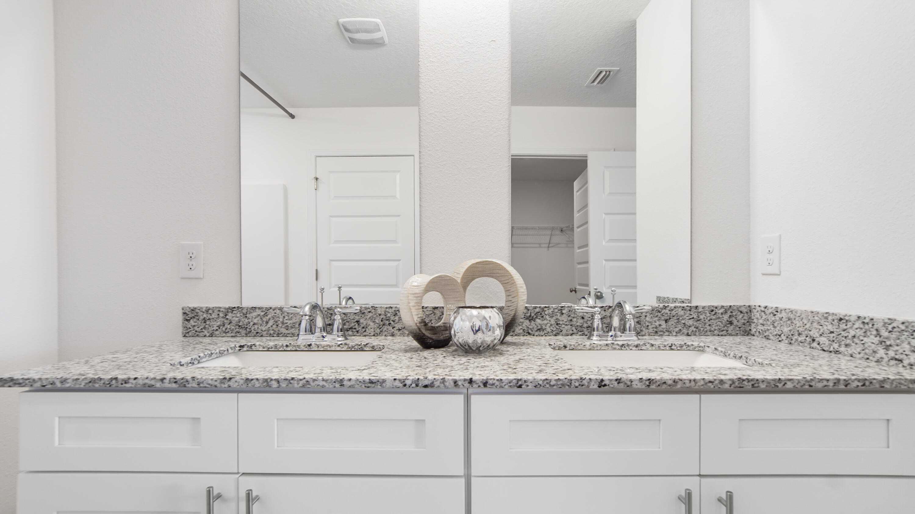 23 Riverwalk Circle Freeport, FL 32439 - Photo 15 of 35 a bathroom with a granite countertop sink and a mirror
