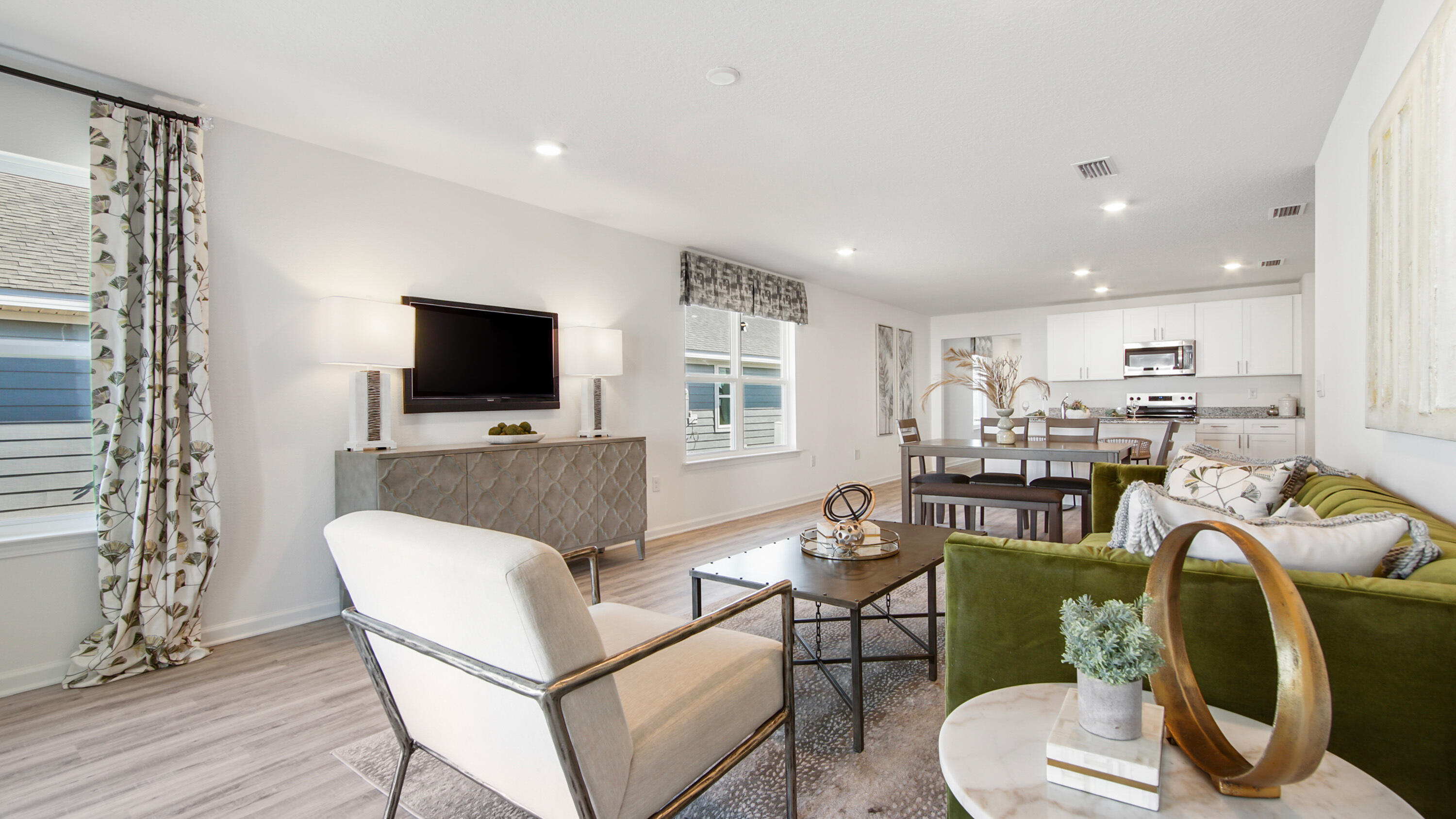 23 Riverwalk Circle Freeport, FL 32439 - Photo 18 of 35 a living room with furniture a flat screen tv and kitchen view