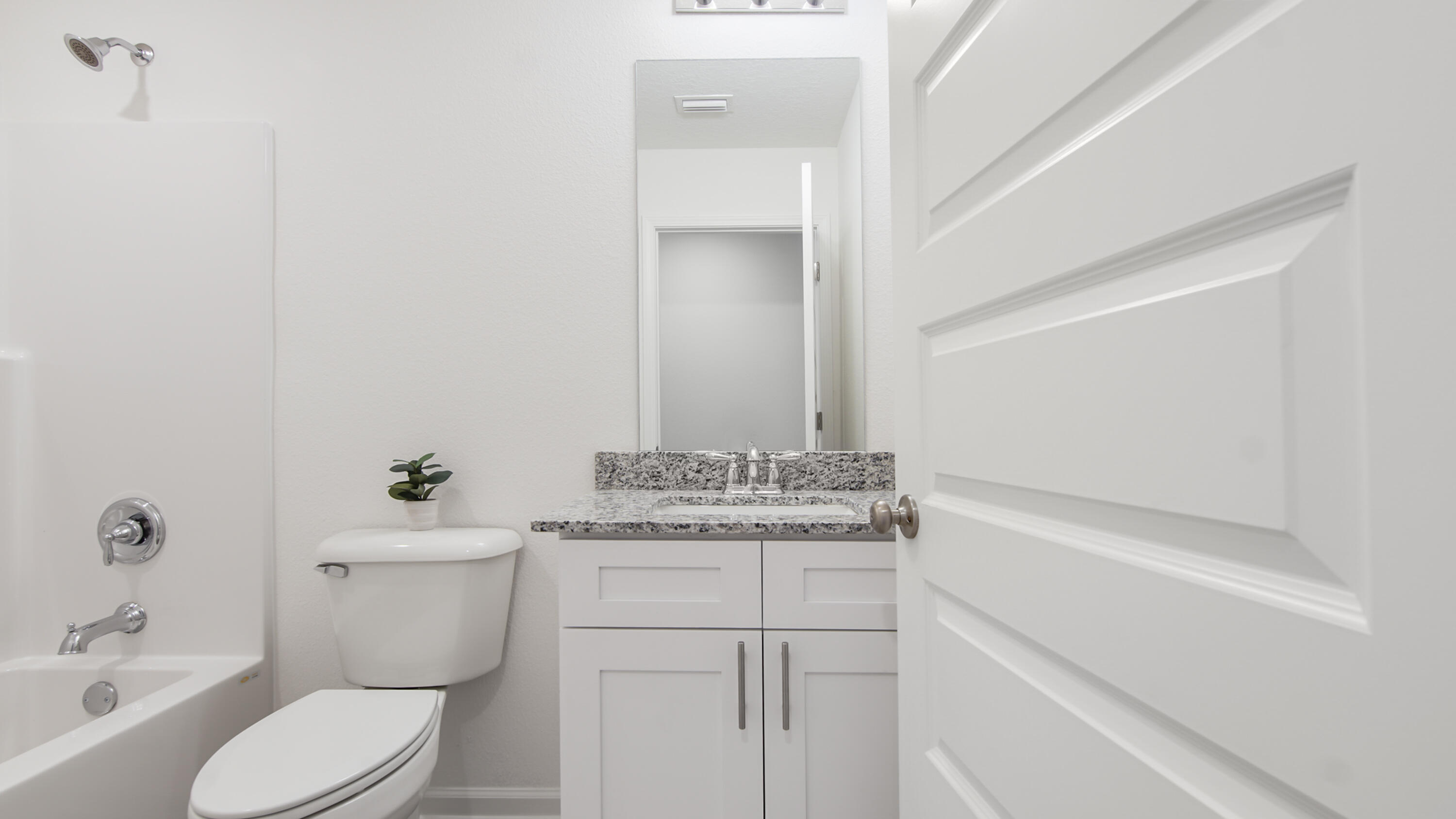 23 Riverwalk Circle Freeport, FL 32439 - Photo 26 of 35 a bathroom with a granite countertop toilet sink and mirror