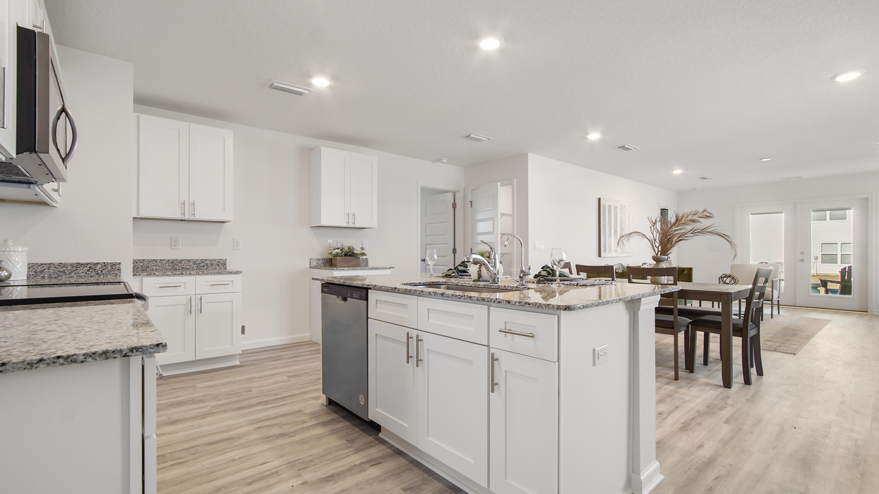 23 Riverwalk Circle Freeport, FL 32439 - Photo 5 of 35 a kitchen with appliances a sink and cabinets