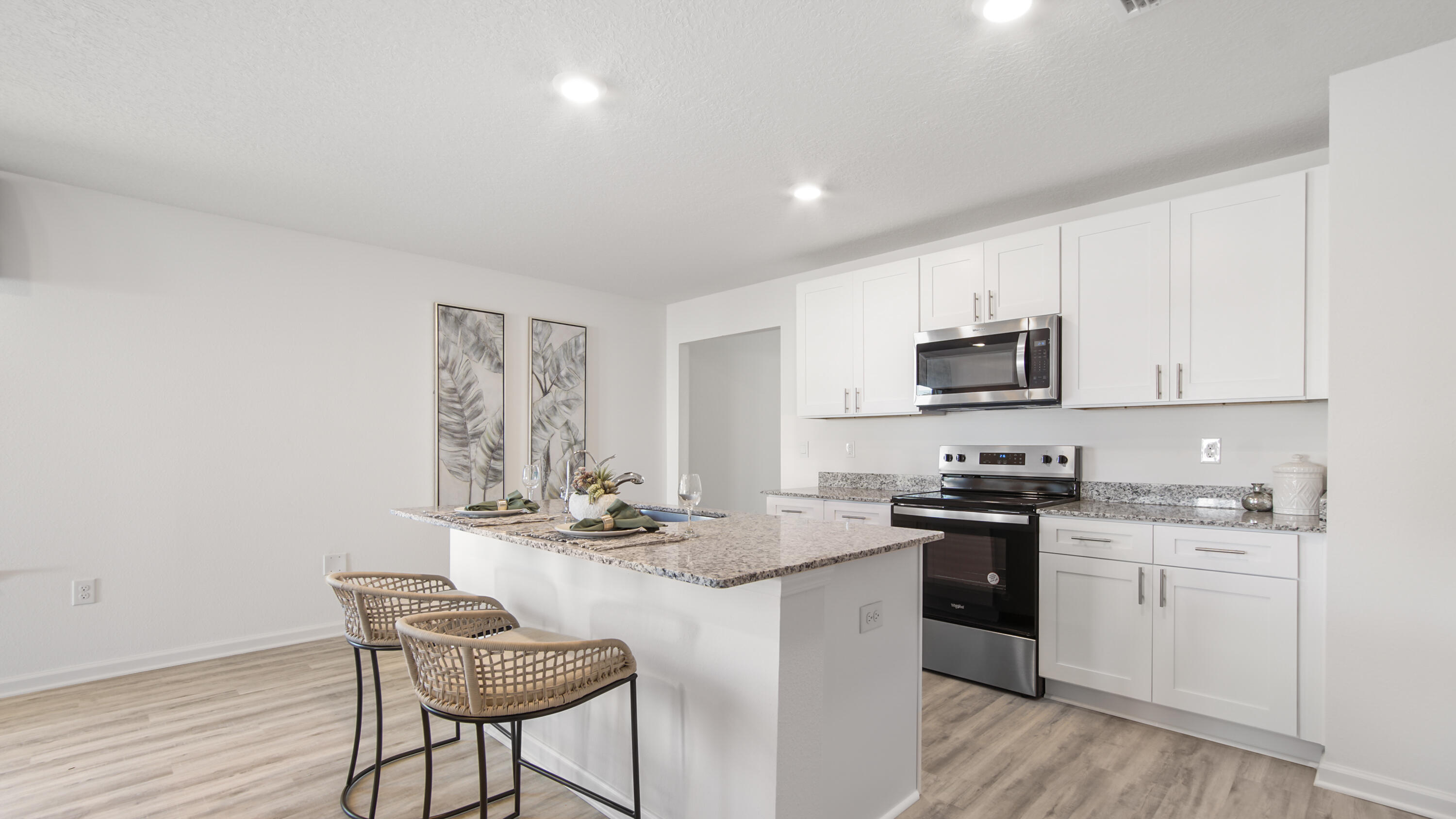 23 Riverwalk Circle Freeport, FL 32439 - Photo 8 of 35 a kitchen with granite countertop a sink stove and cabinets