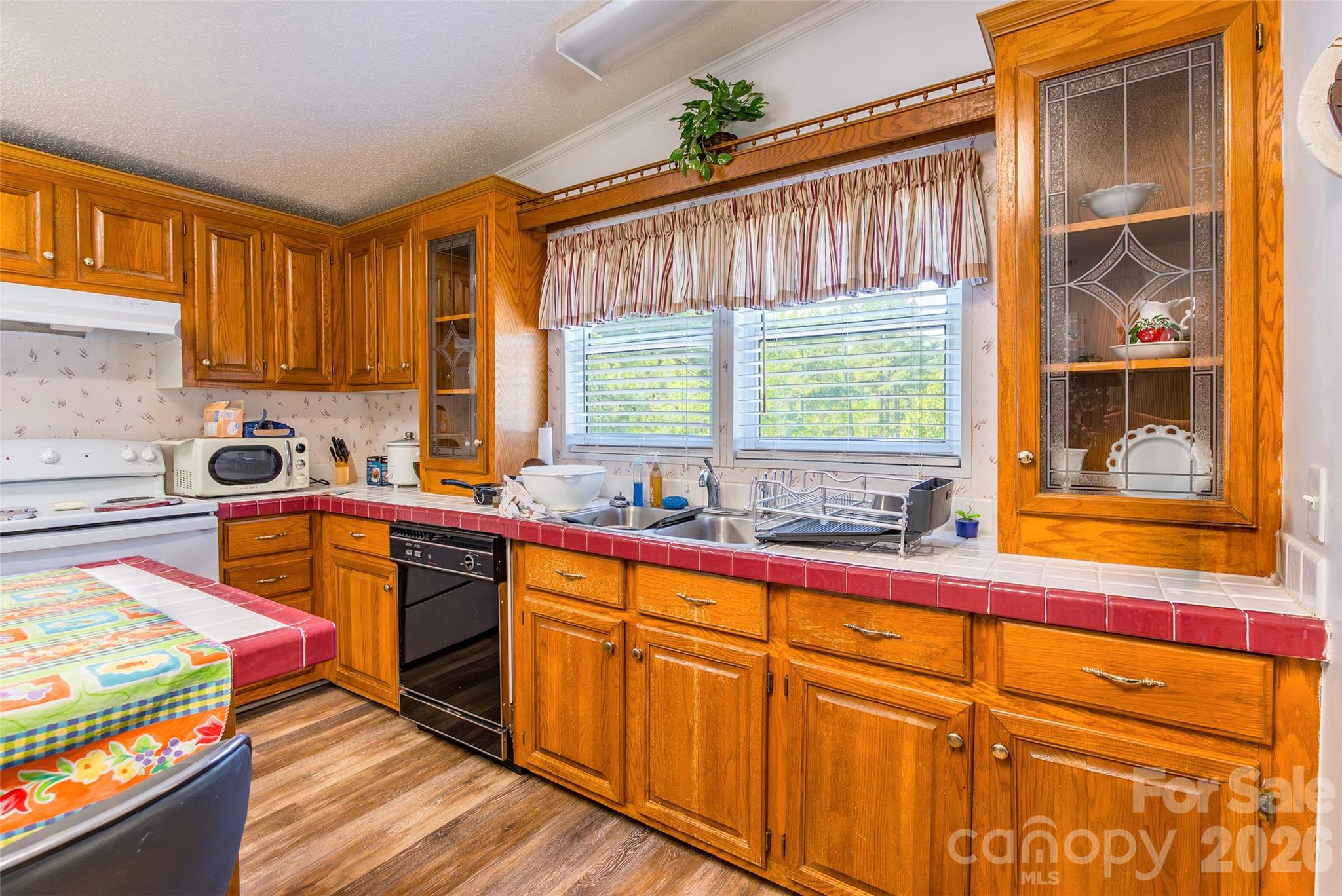 777 John Doster Road Pageland, SC 29728 - Photo 14 of 34 a kitchen with stainless steel appliances granite countertop a sink and a stove