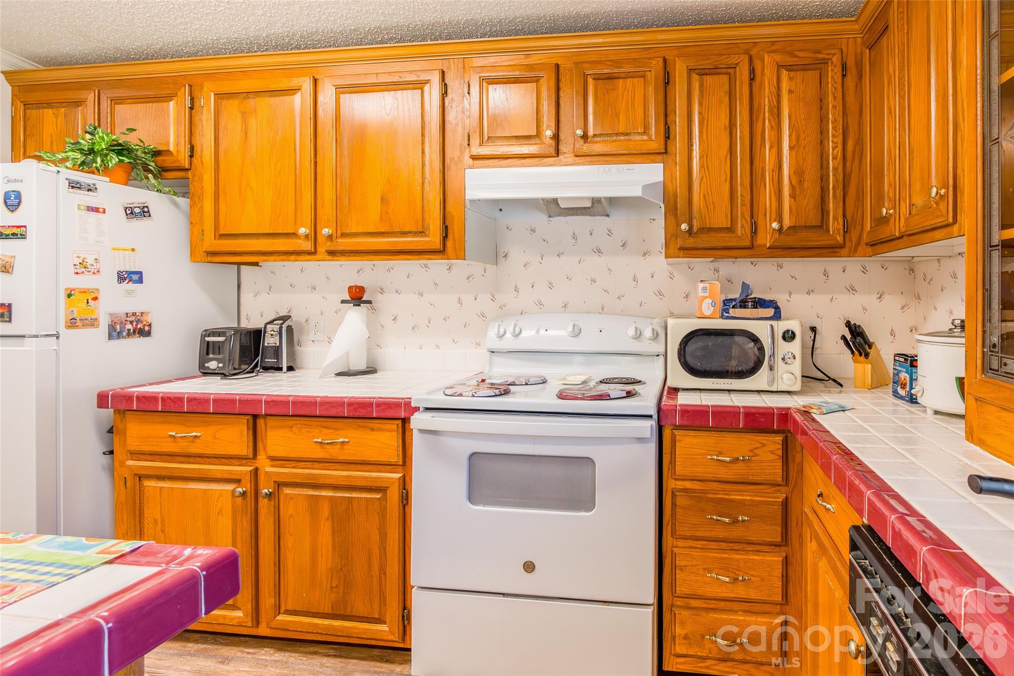 777 John Doster Road Pageland, SC 29728 - Photo 15 of 34 a kitchen with stainless steel appliances granite countertop a sink and cabinets