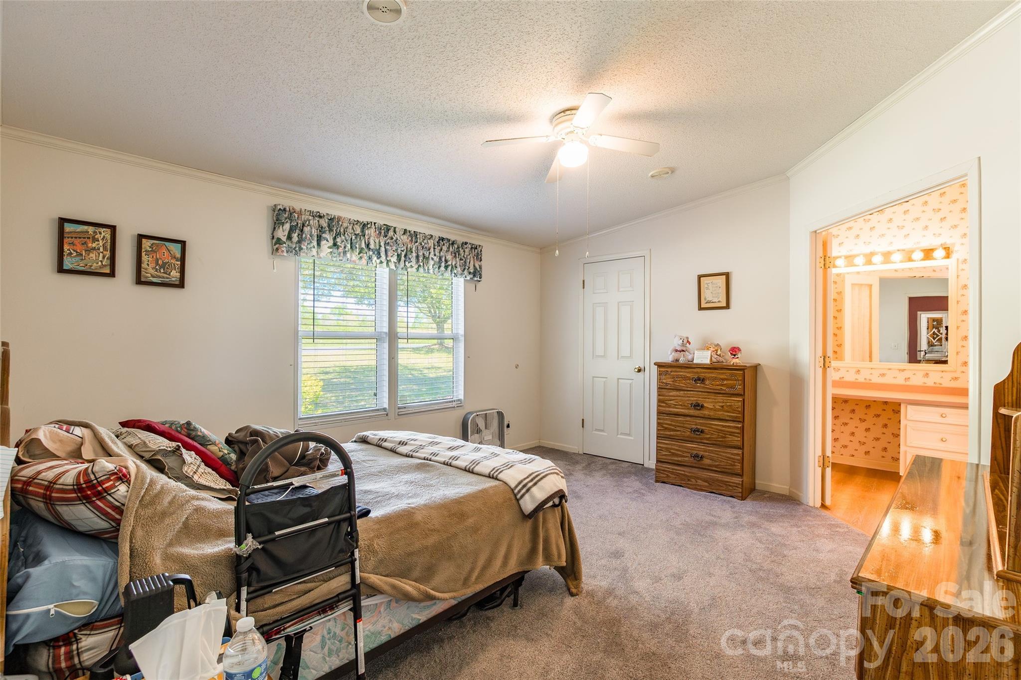 777 John Doster Road Pageland, SC 29728 - Photo 17 of 34 a bedroom with a bed and a window