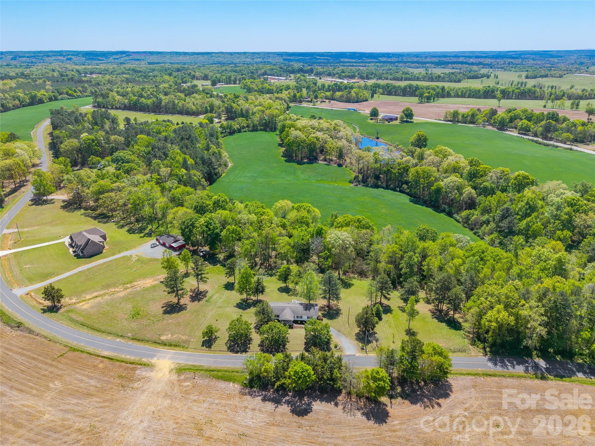 777 John Doster Road Pageland, SC 29728 - Photo 2 of 34 a view of a lake with a city
