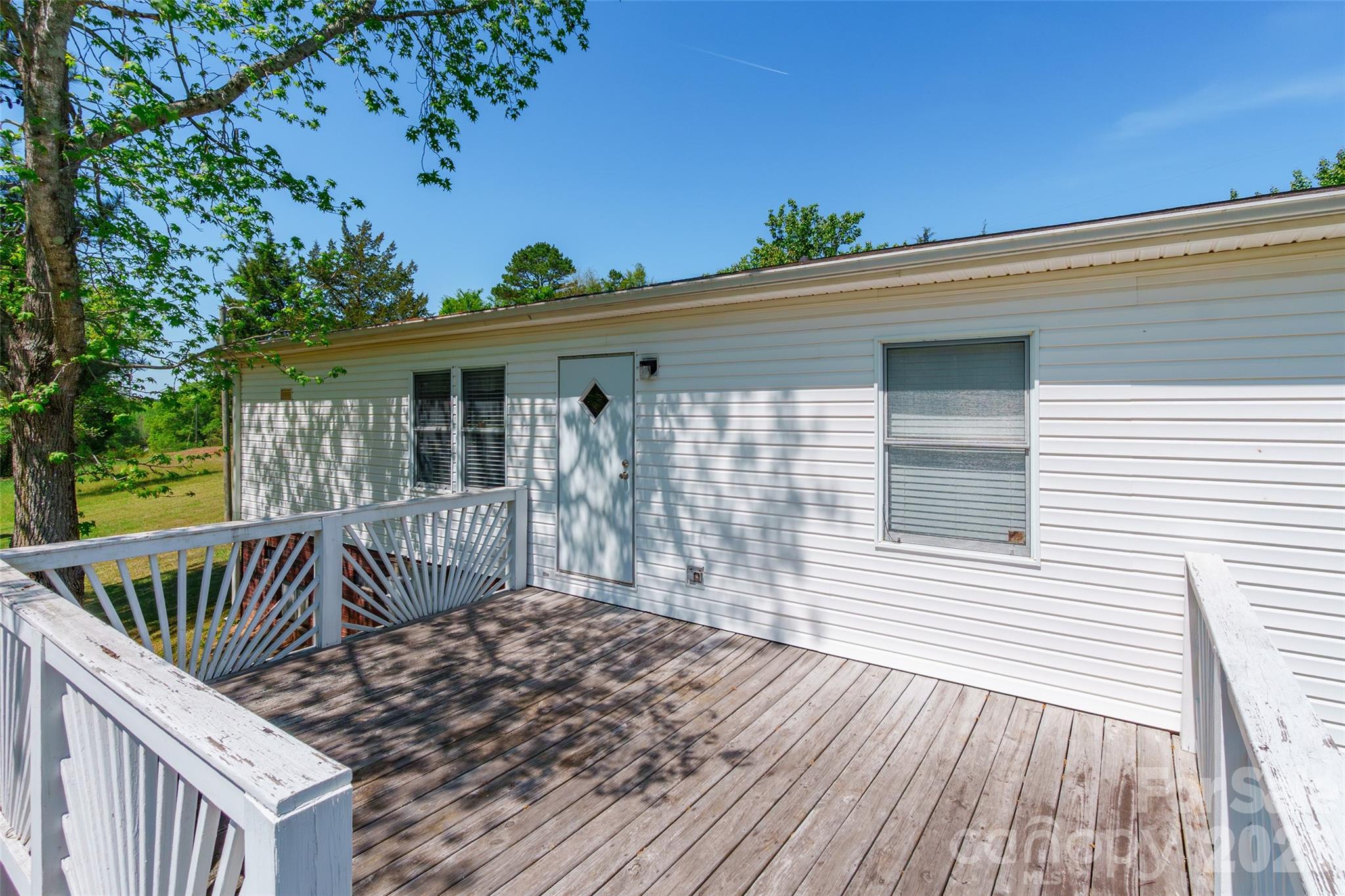 777 John Doster Road Pageland, SC 29728 - Photo 29 of 34 a view of a house with a wooden deck