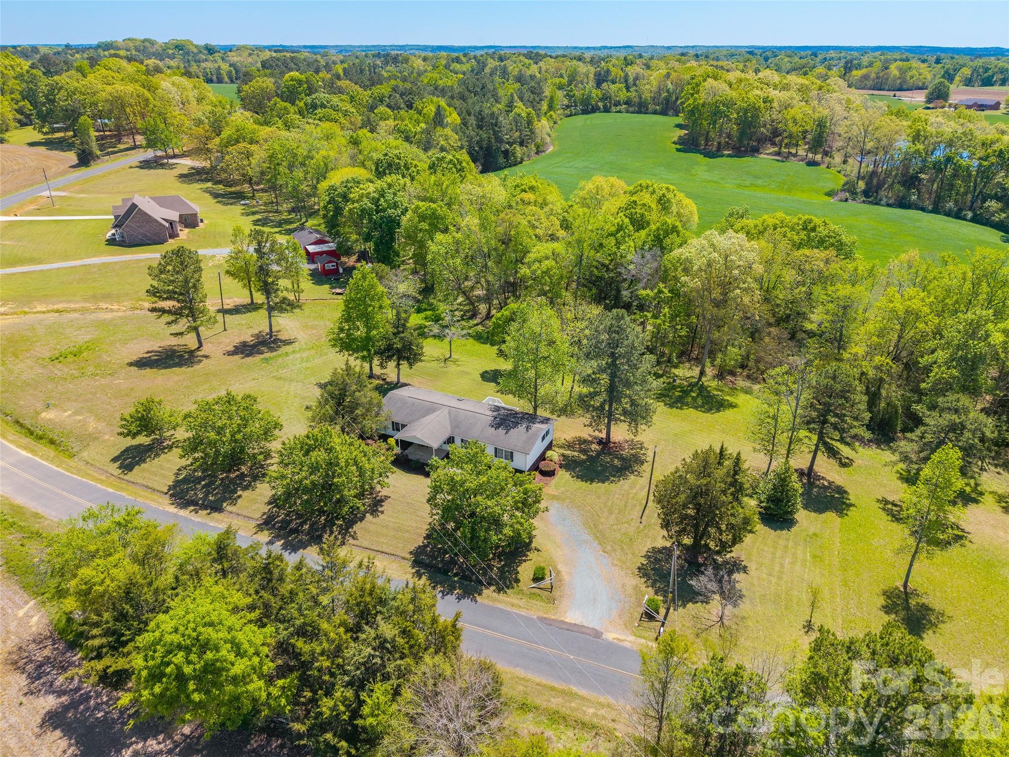 777 John Doster Road Pageland, SC 29728 - Photo 34 of 34 an aerial view of residential houses with outdoor space and swimming pool