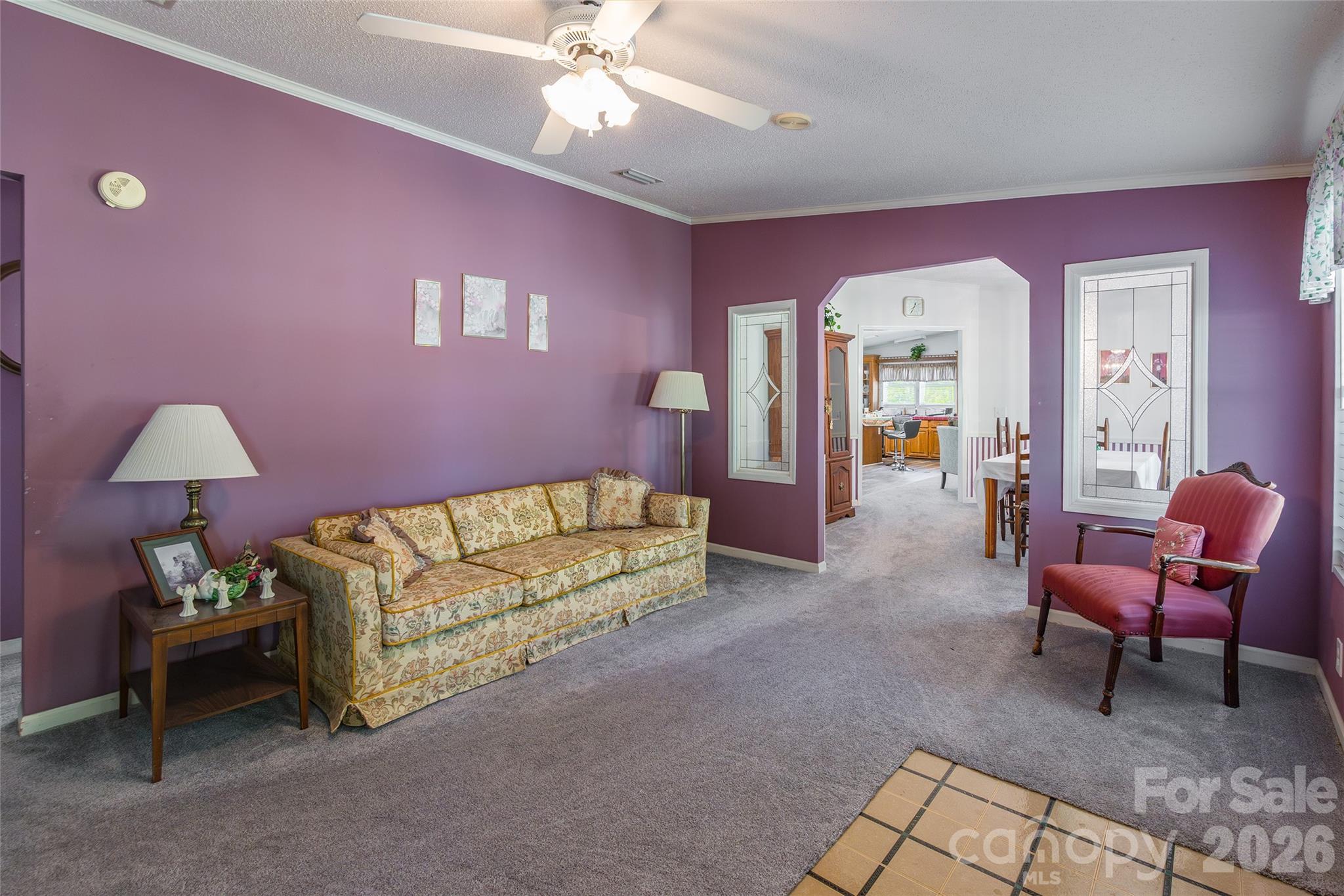 777 John Doster Road Pageland, SC 29728 - Photo 5 of 34 a living room with furniture and a chandelier