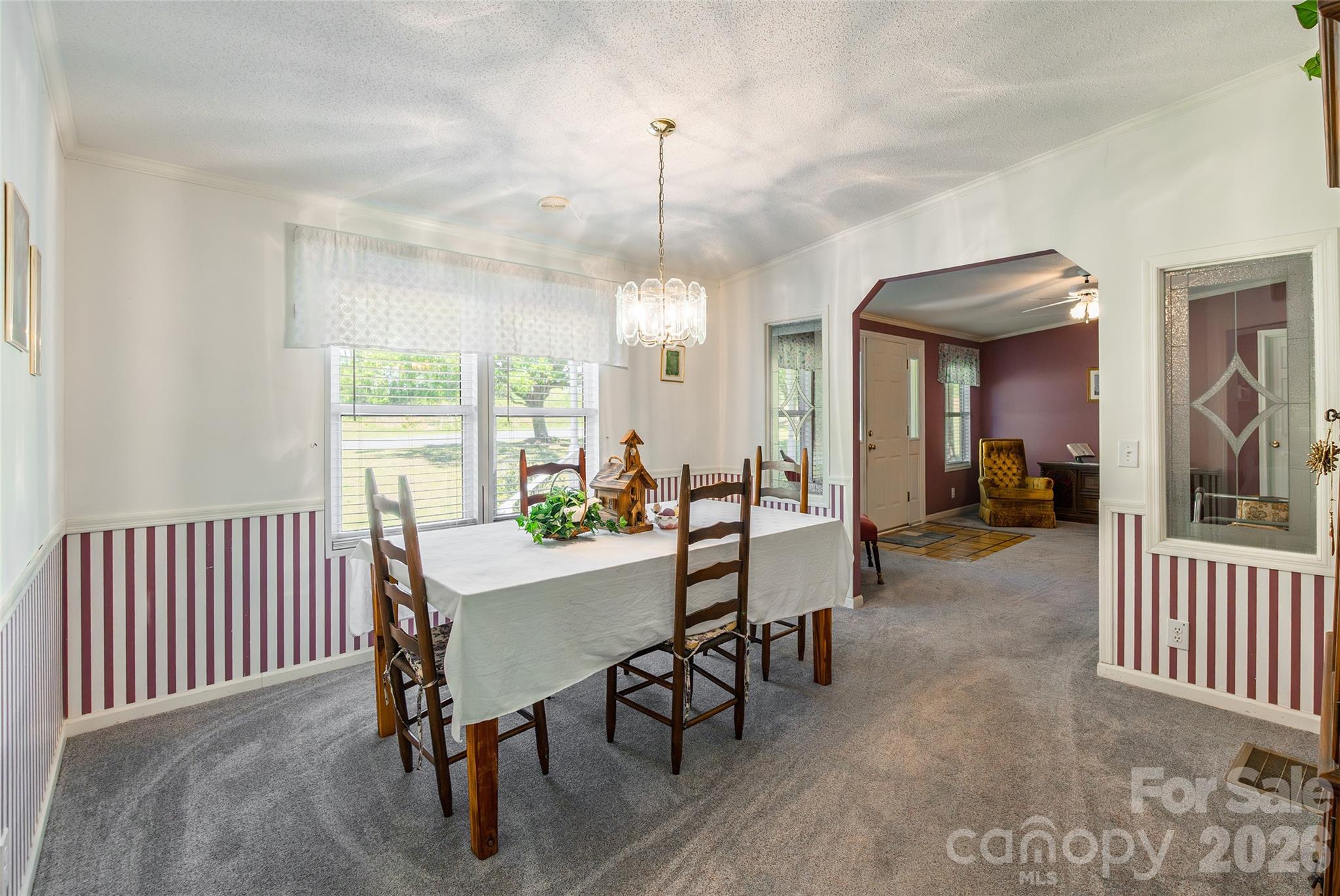 777 John Doster Road Pageland, SC 29728 - Photo 9 of 34 a view of a dining room with furniture window and wooden floor