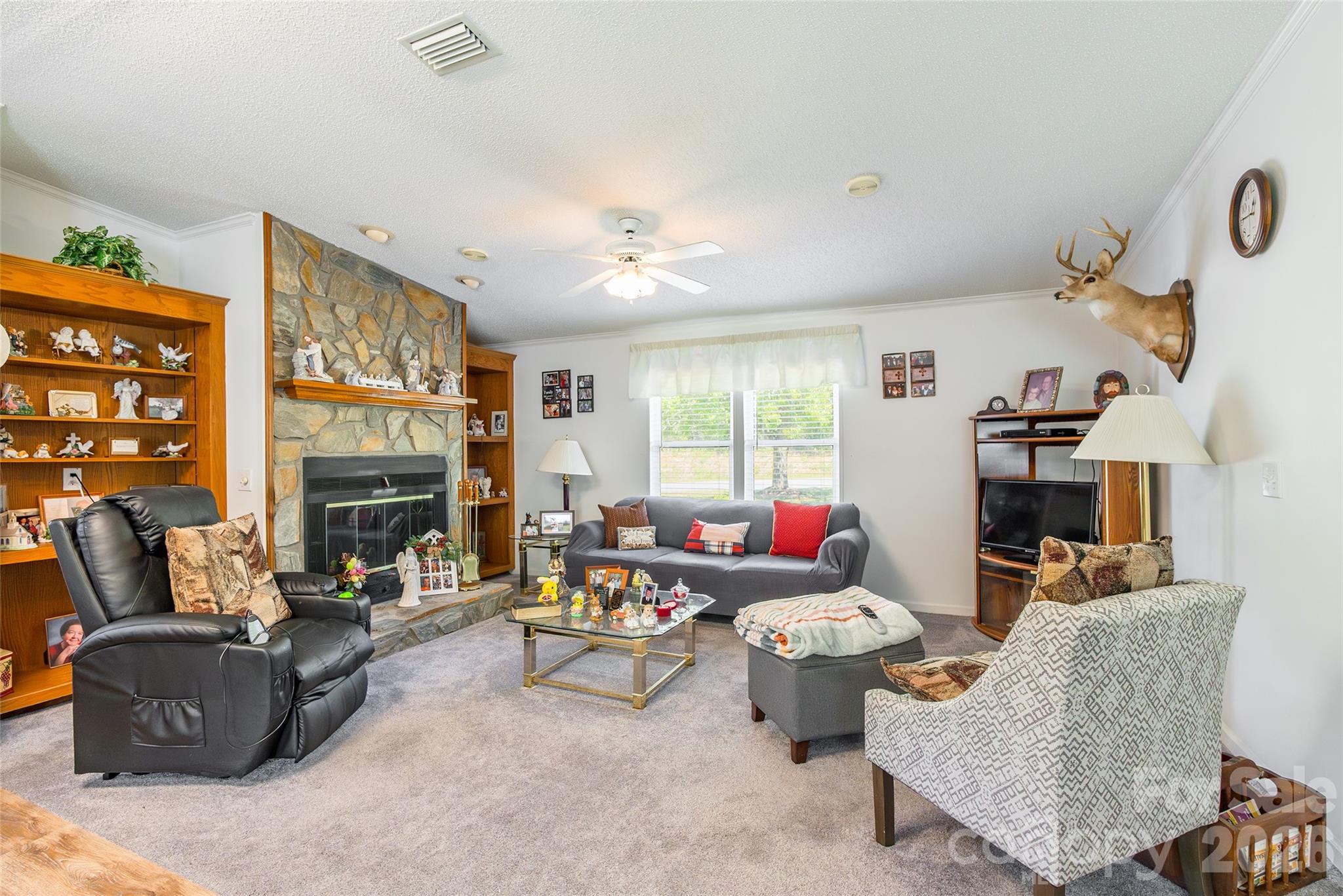 777 John Doster Road Pageland, SC 29728 - Photo 10 of 34 a living room with furniture fireplace and a window