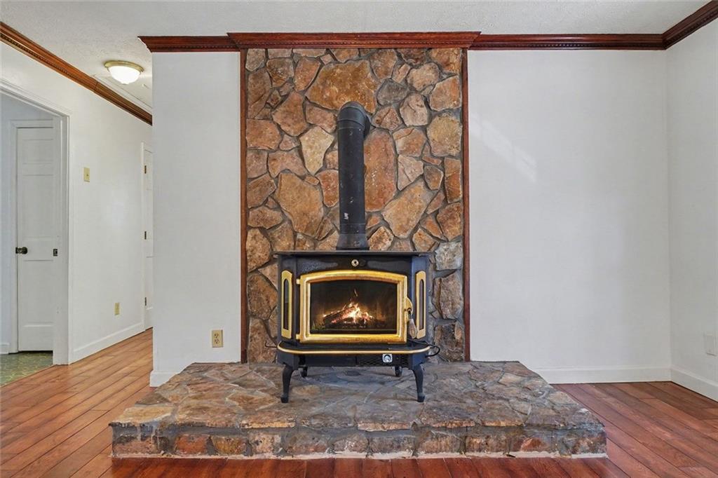 5295 Ridge Road Douglasville, GA 30134 - Photo 10 of 36 a living room with a rug and a wooden floor