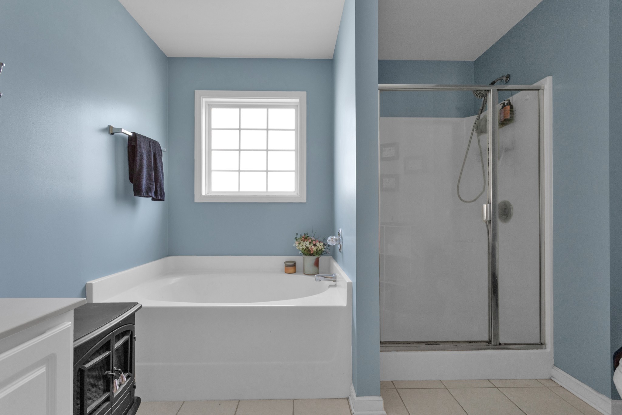 2105 Burgess Lane Spring Hill, TN 37174 - Photo 23 of 36 a bathroom with a bathtub and shower