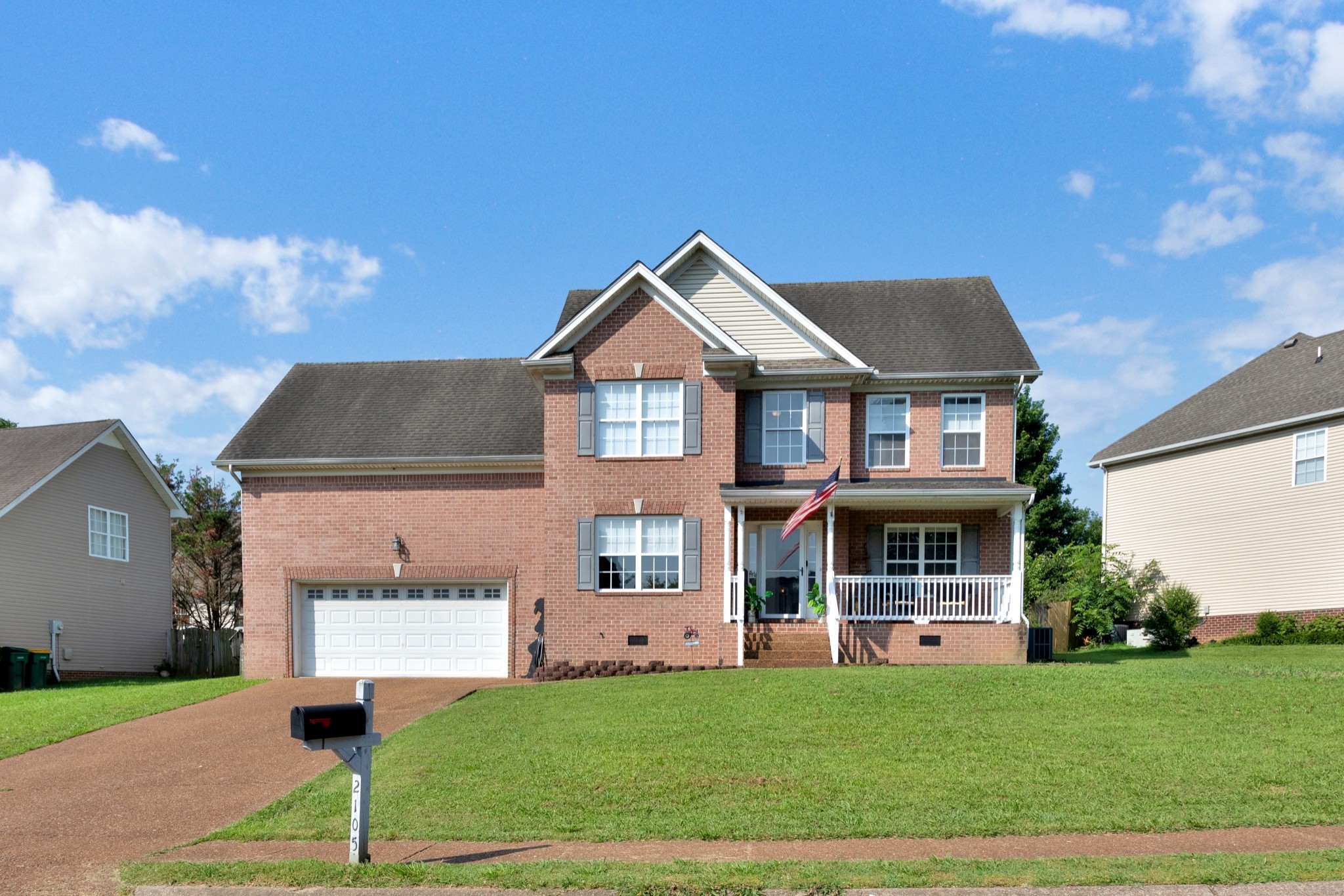2105 Burgess Lane Spring Hill, TN 37174 - Photo 3 of 36 a front view of a house with a yard