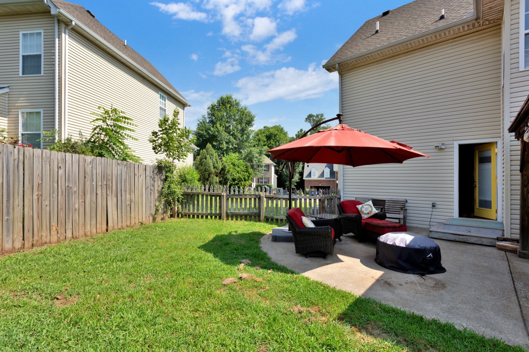 2105 Burgess Lane Spring Hill, TN 37174 - Photo 33 of 36 a backyard of a house with table and chairs