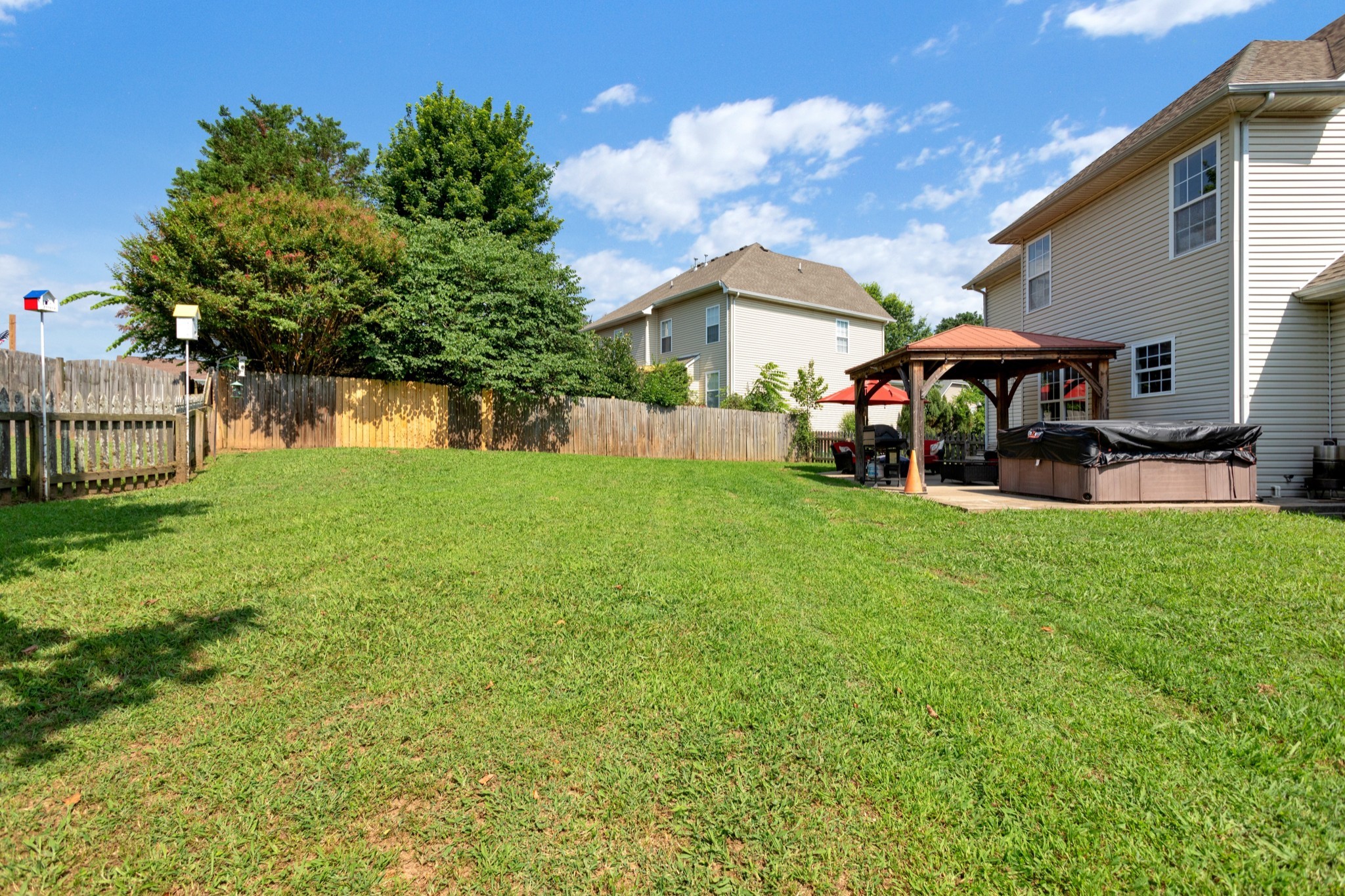 2105 Burgess Lane Spring Hill, TN 37174 - Photo 34 of 36 a view of a house with a yard porch and sitting area