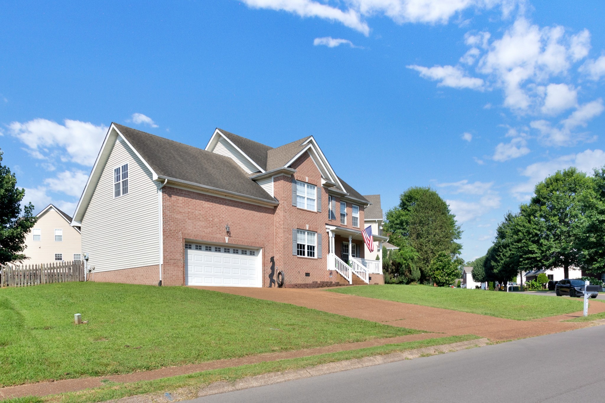 2105 Burgess Lane Spring Hill, TN 37174 - Photo 4 of 36 a front view of a house with a yard and garage