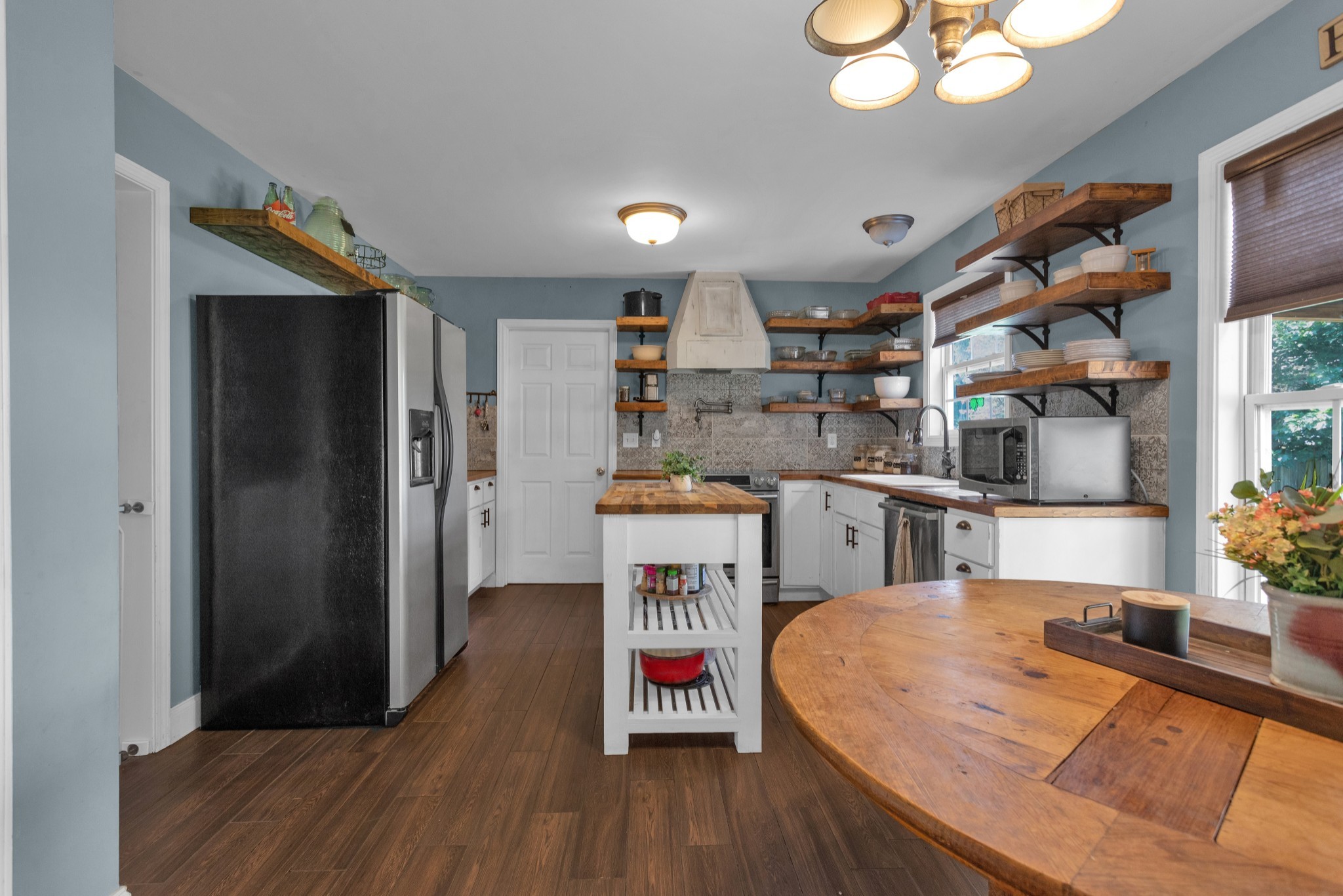 2105 Burgess Lane Spring Hill, TN 37174 - Photo 9 of 36 a kitchen with stainless steel appliances granite countertop a refrigerator a stove and a wooden floors