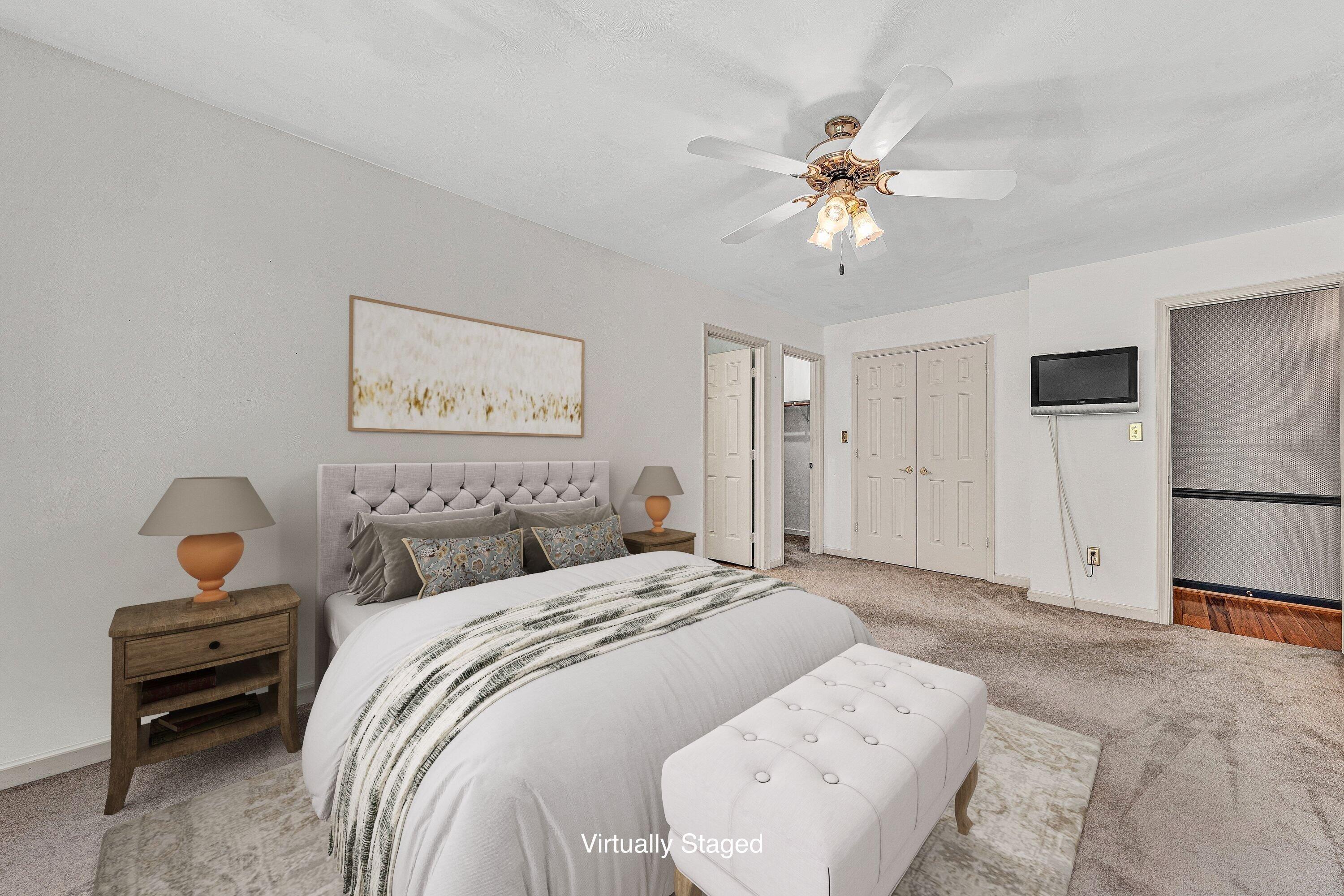 29 Serenity Lane Blue Ridge, VA 24064 - Photo 21 of 81 a bedroom with a bed and a chandelier