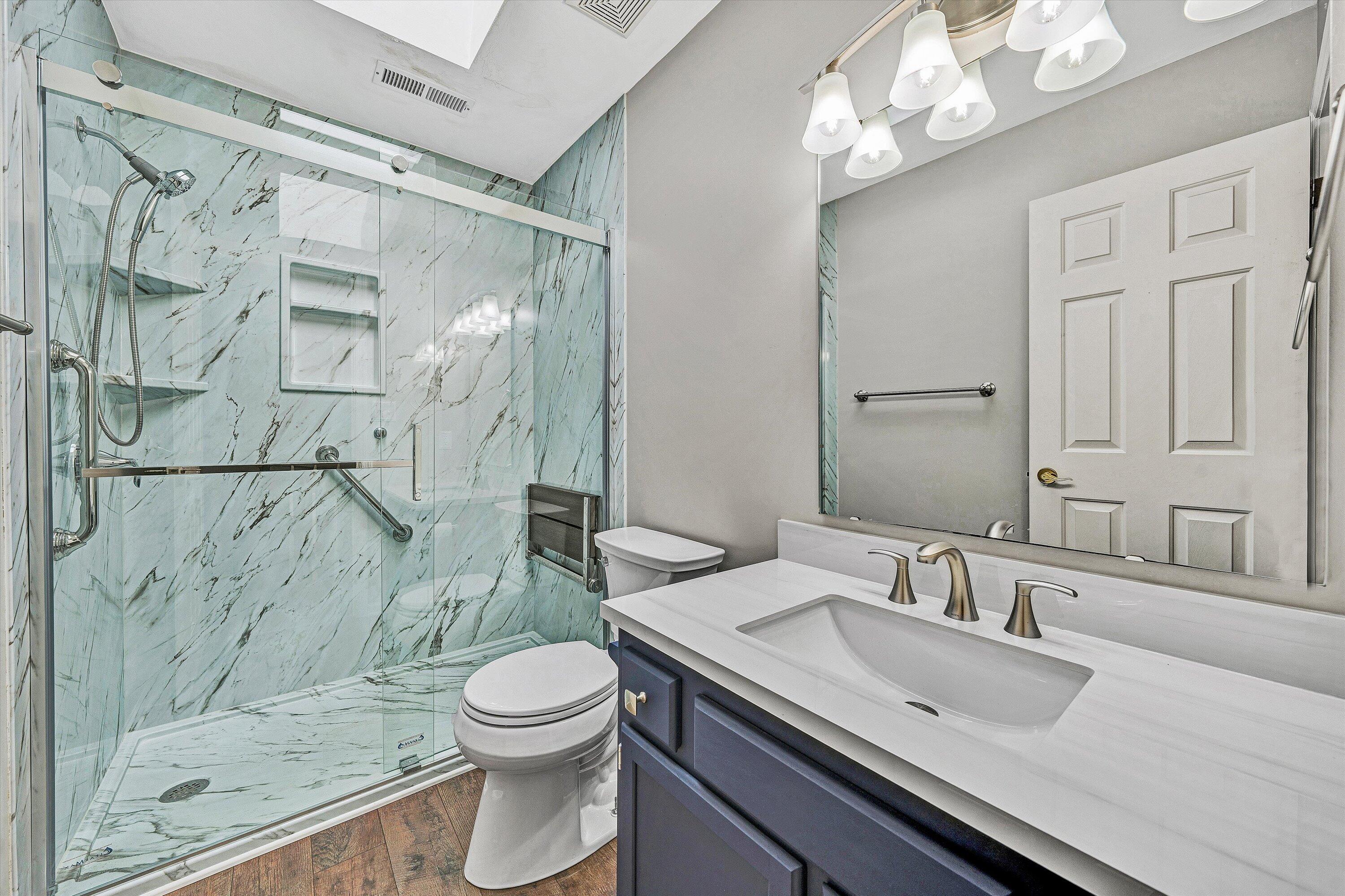 29 Serenity Lane Blue Ridge, VA 24064 - Photo 31 of 81 a bathroom with a granite countertop sink toilet a mirror and shower