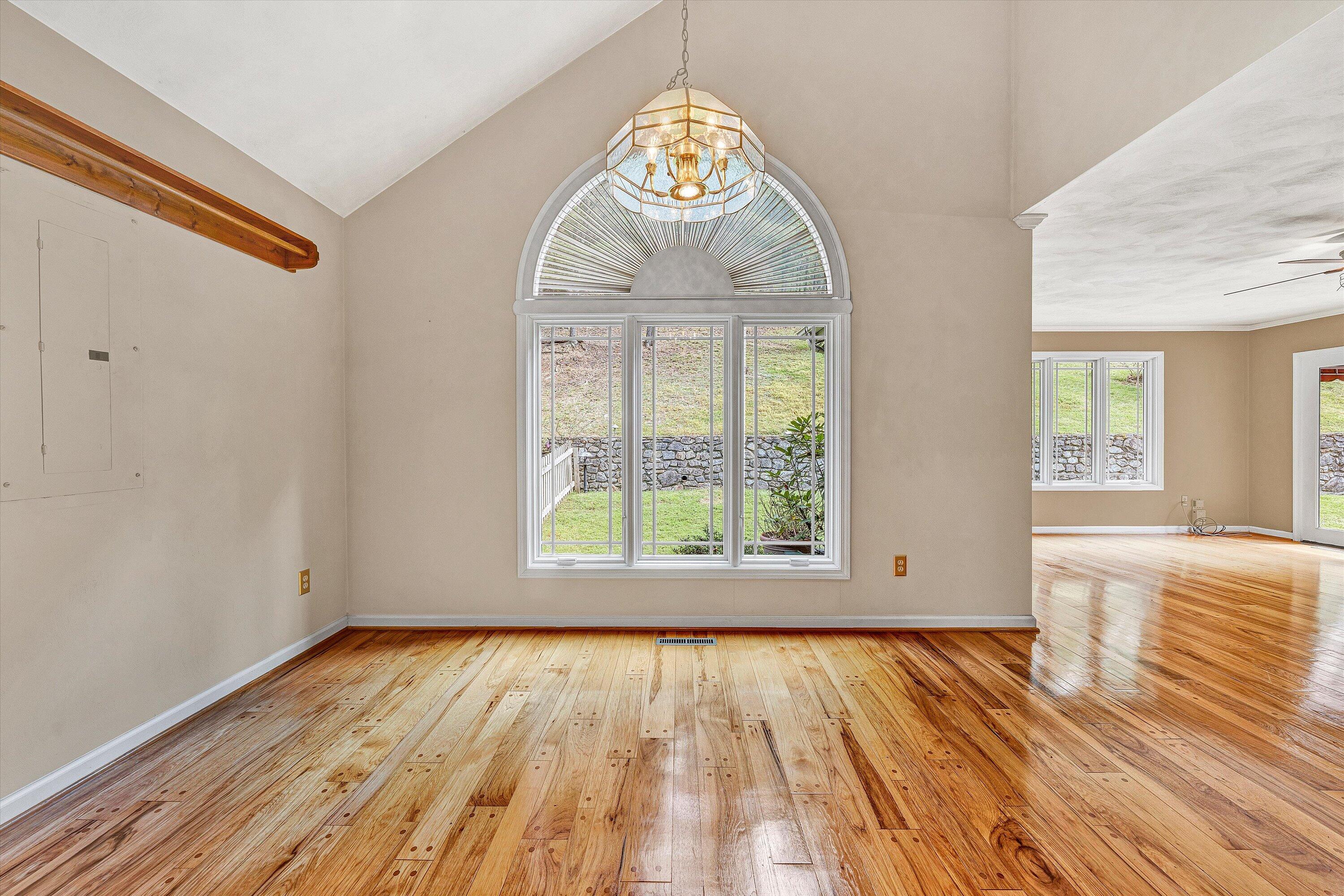 29 Serenity Lane Blue Ridge, VA 24064 - Photo 9 of 81 an empty room with wooden floor and windows