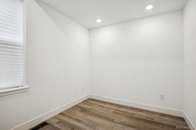 a white toilet sitting next to a white sink