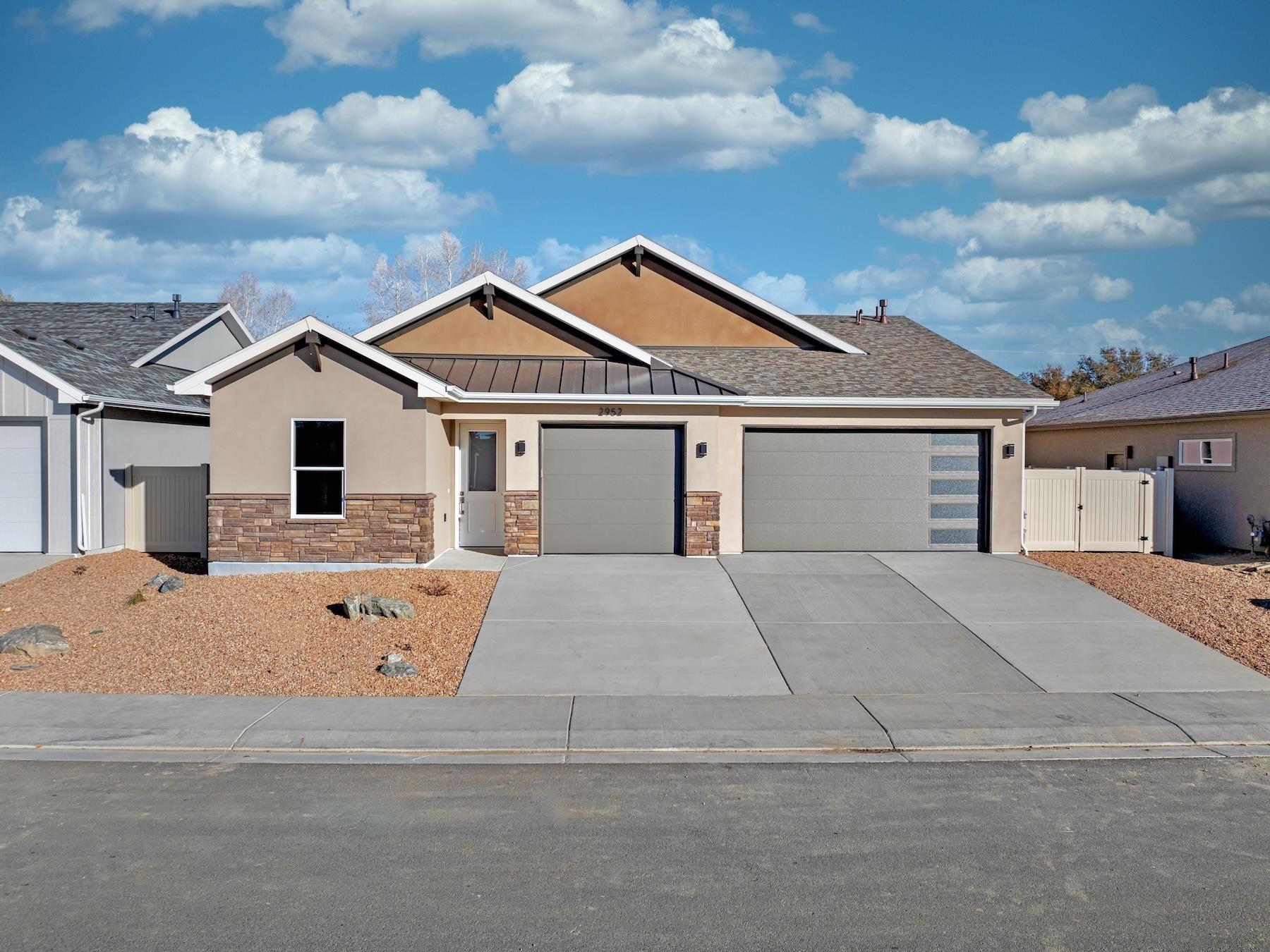 2952 Apollo Drive Grand Junction, CO 81504 - Photo 1 of 27 front view of a house with a stove and a yard