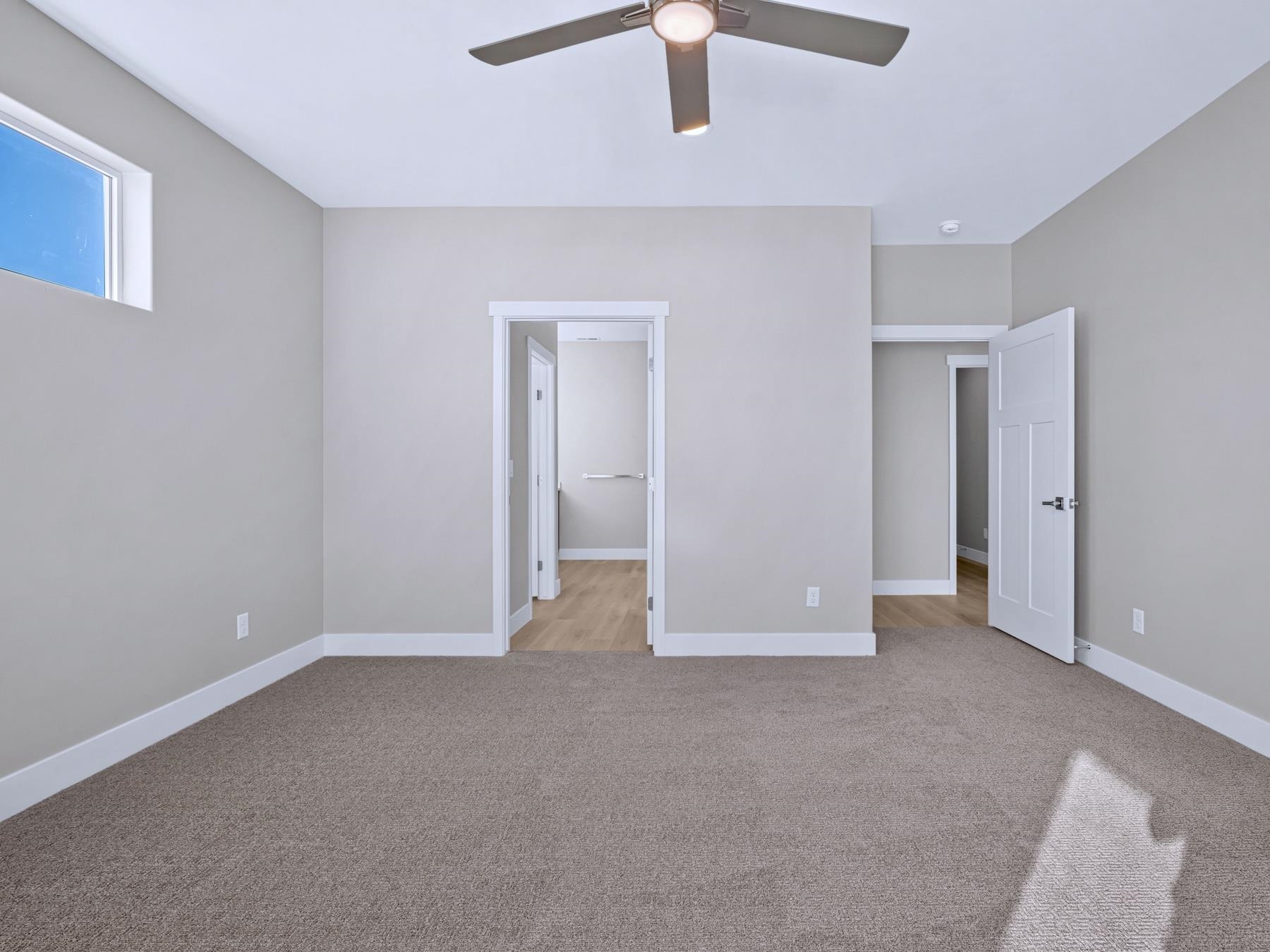 2952 Apollo Drive Grand Junction, CO 81504 - Photo 13 of 27 an empty room with chandelier fan