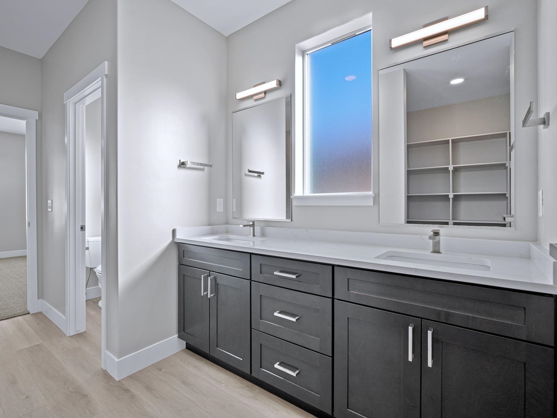 2952 Apollo Drive Grand Junction, CO 81504 - Photo 14 of 27 a bathroom with a granite countertop sink double and mirror