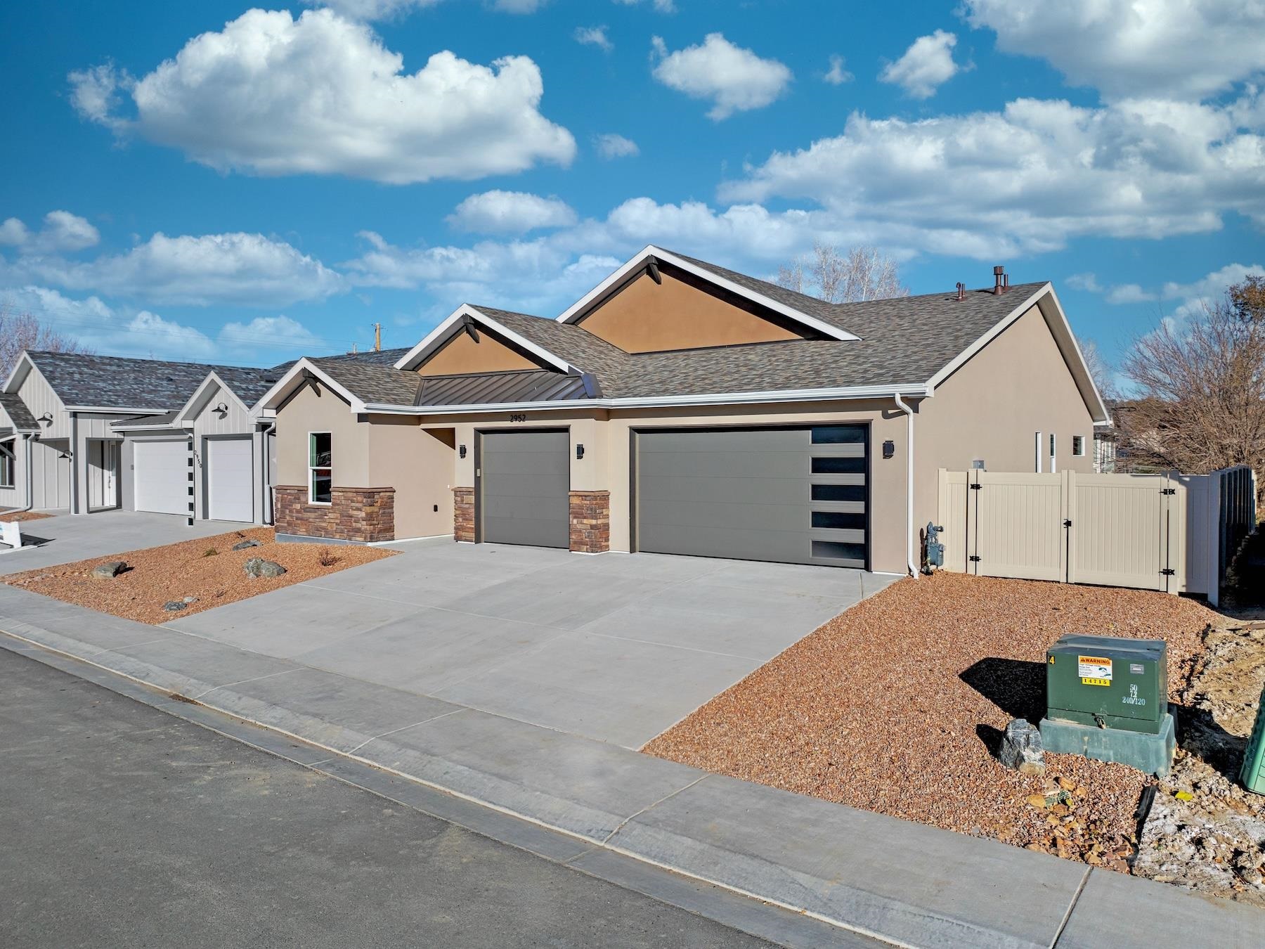 2952 Apollo Drive Grand Junction, CO 81504 - Photo 2 of 27 a front view of a house with garden