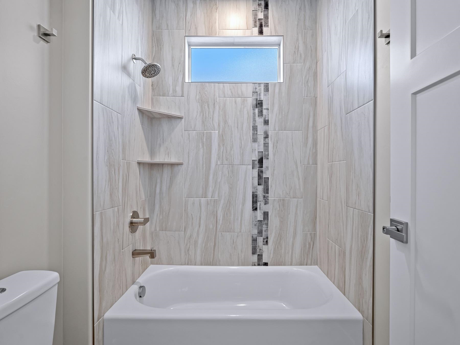 2952 Apollo Drive Grand Junction, CO 81504 - Photo 21 of 27 a bathroom with a bathtub and shower