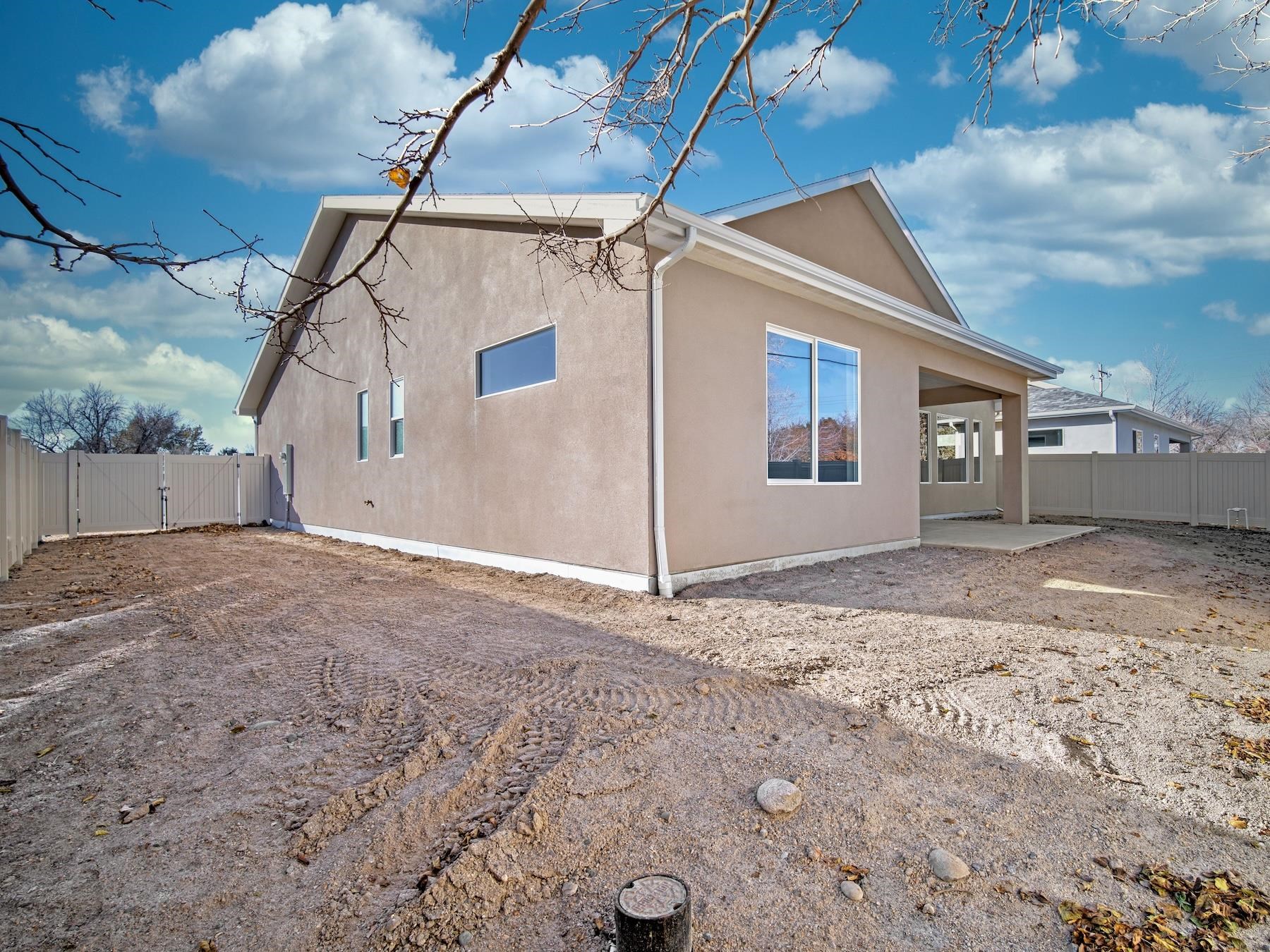 2952 Apollo Drive Grand Junction, CO 81504 - Photo 23 of 27 a view of a house with a snow in the yard