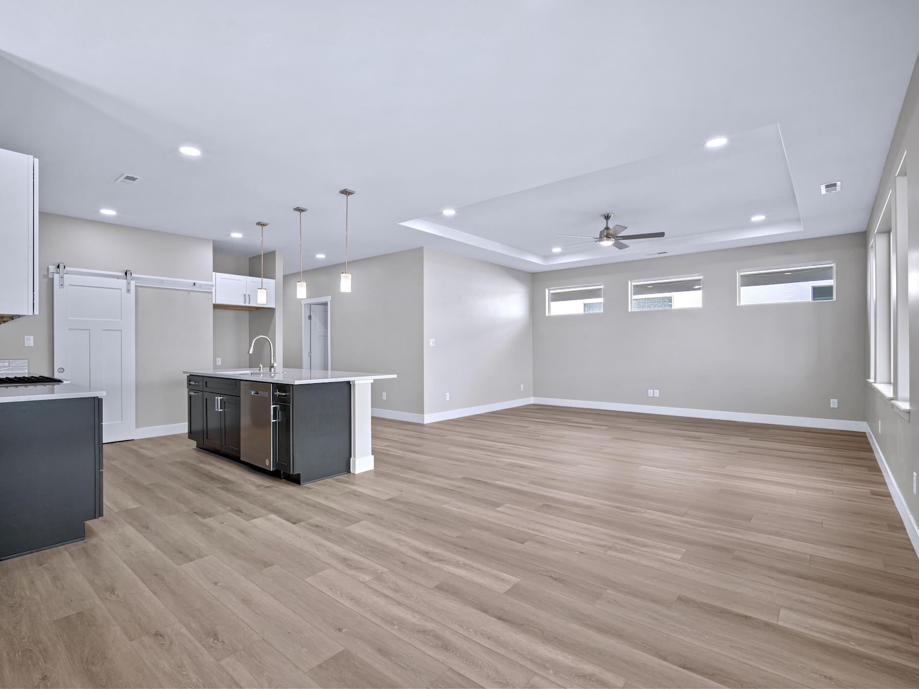 2952 Apollo Drive Grand Junction, CO 81504 - Photo 8 of 27 a view of kitchen with kitchen island large wooden floor appliances and cabinets