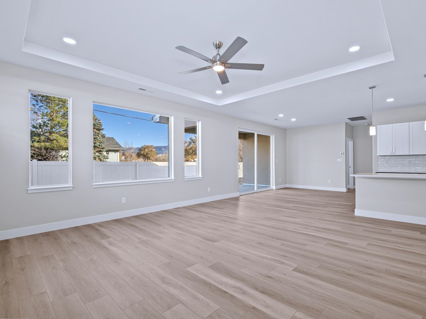 2952 Apollo Drive Grand Junction, CO 81504 - Photo 10 of 27 a view of an empty room with a window and wooden floor