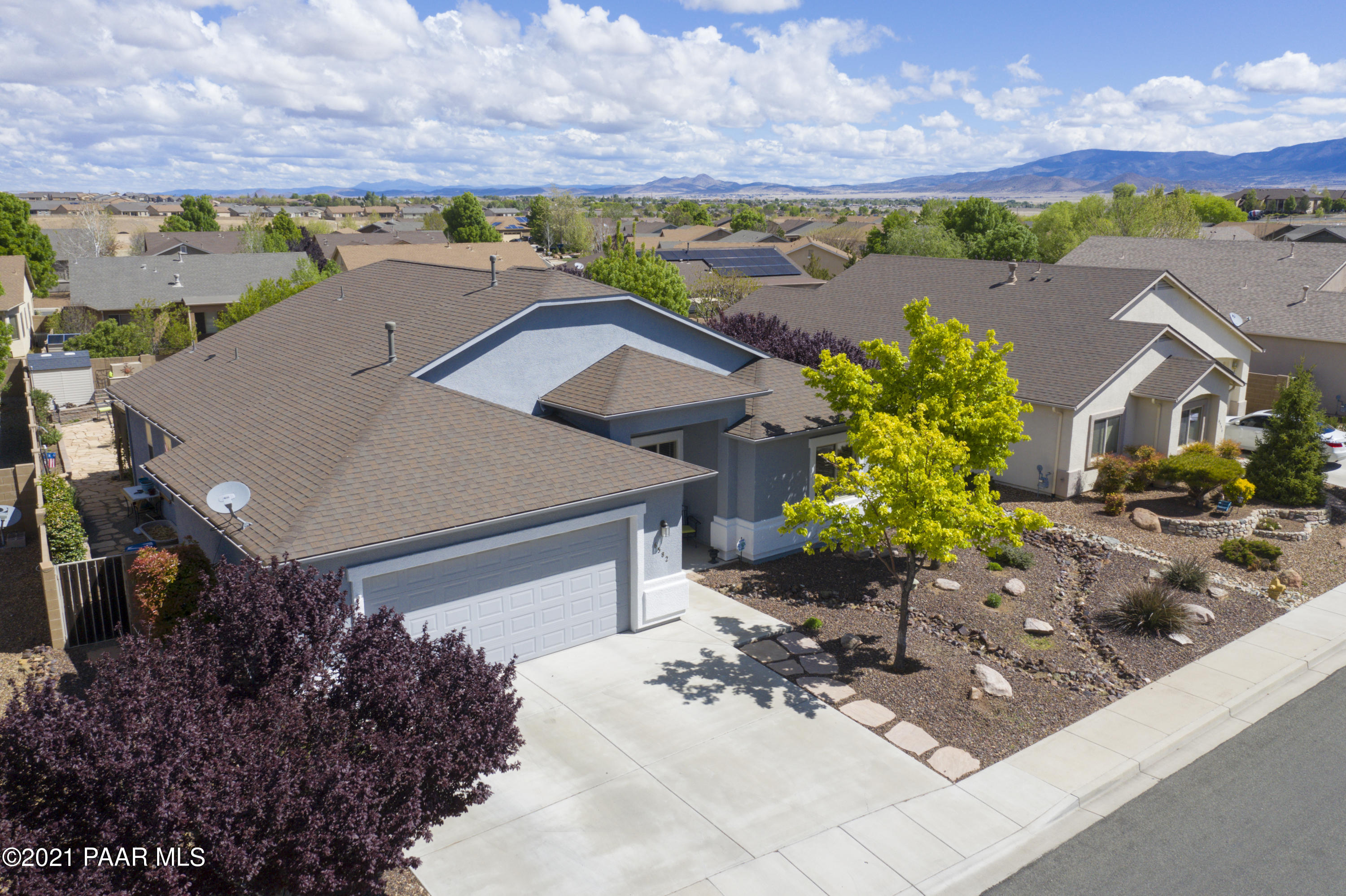 6582 Farmstead Road, Unit 3 Prescott Valley, AZ 86314 - Photo 2 of 41 a view of a house with a yard