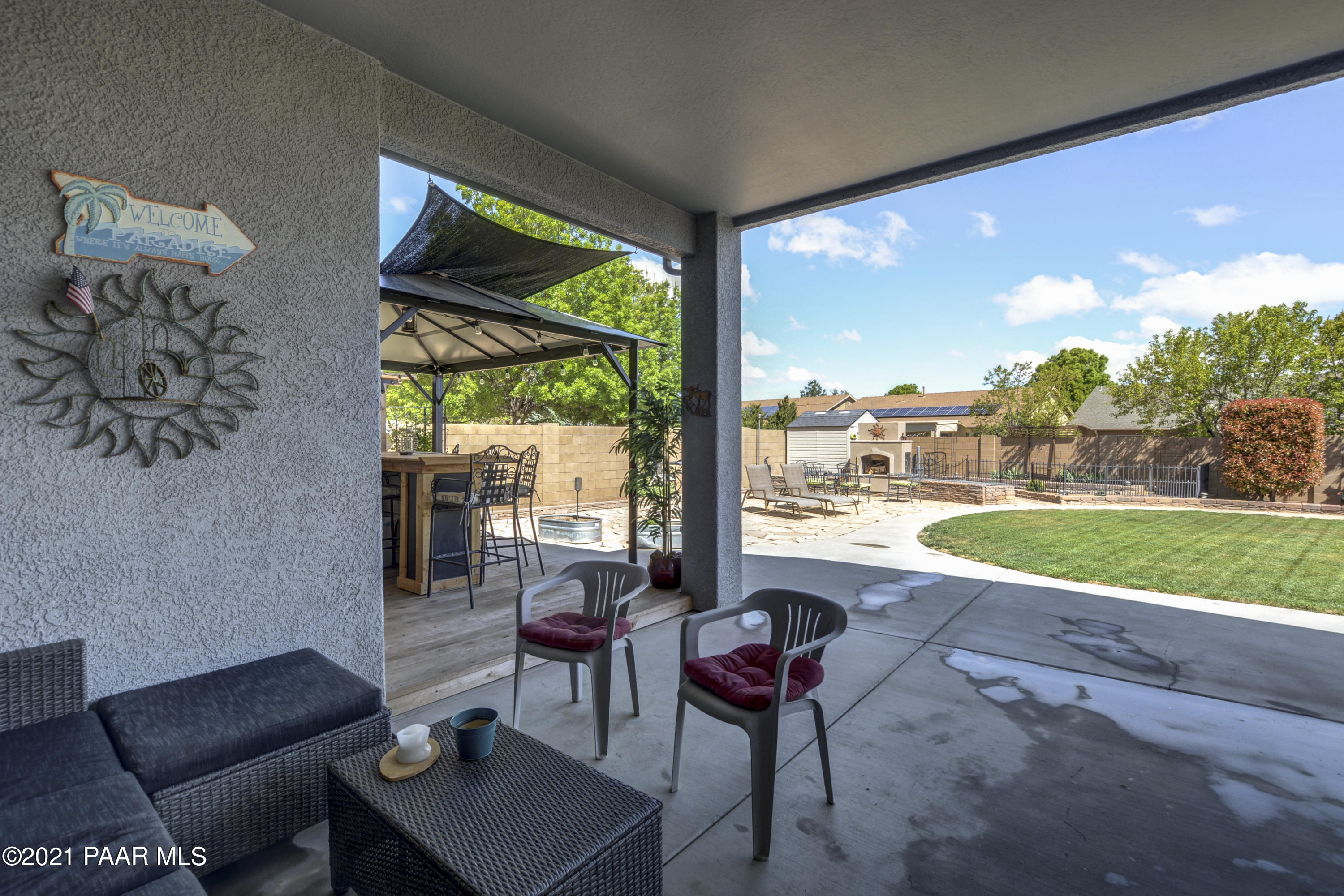6582 Farmstead Road, Unit 3 Prescott Valley, AZ 86314 - Photo 23 of 41 a view of a porch with furniture and yard