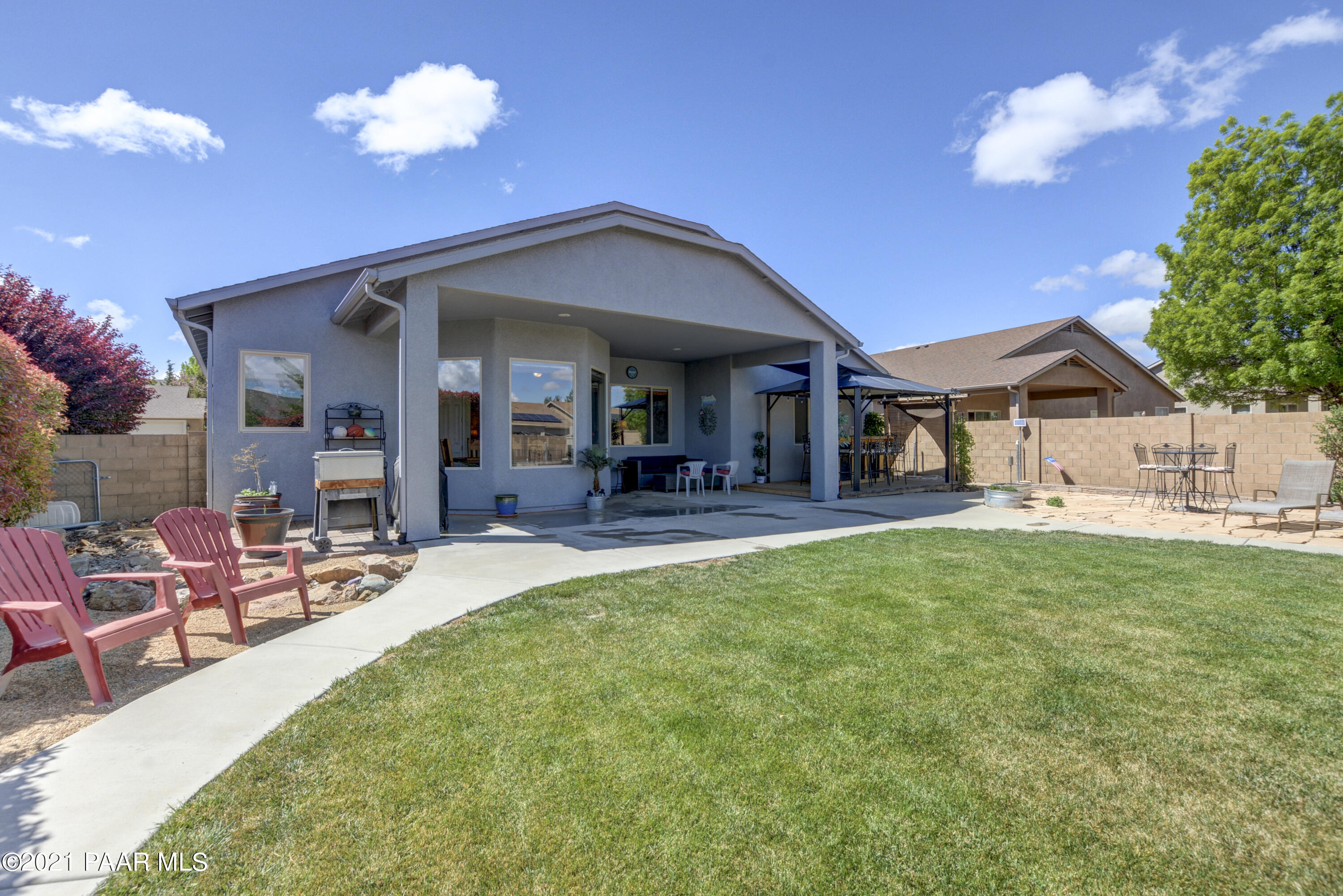 6582 Farmstead Road, Unit 3 Prescott Valley, AZ 86314 - Photo 26 of 41 a view of a house with backyard porch and sitting area