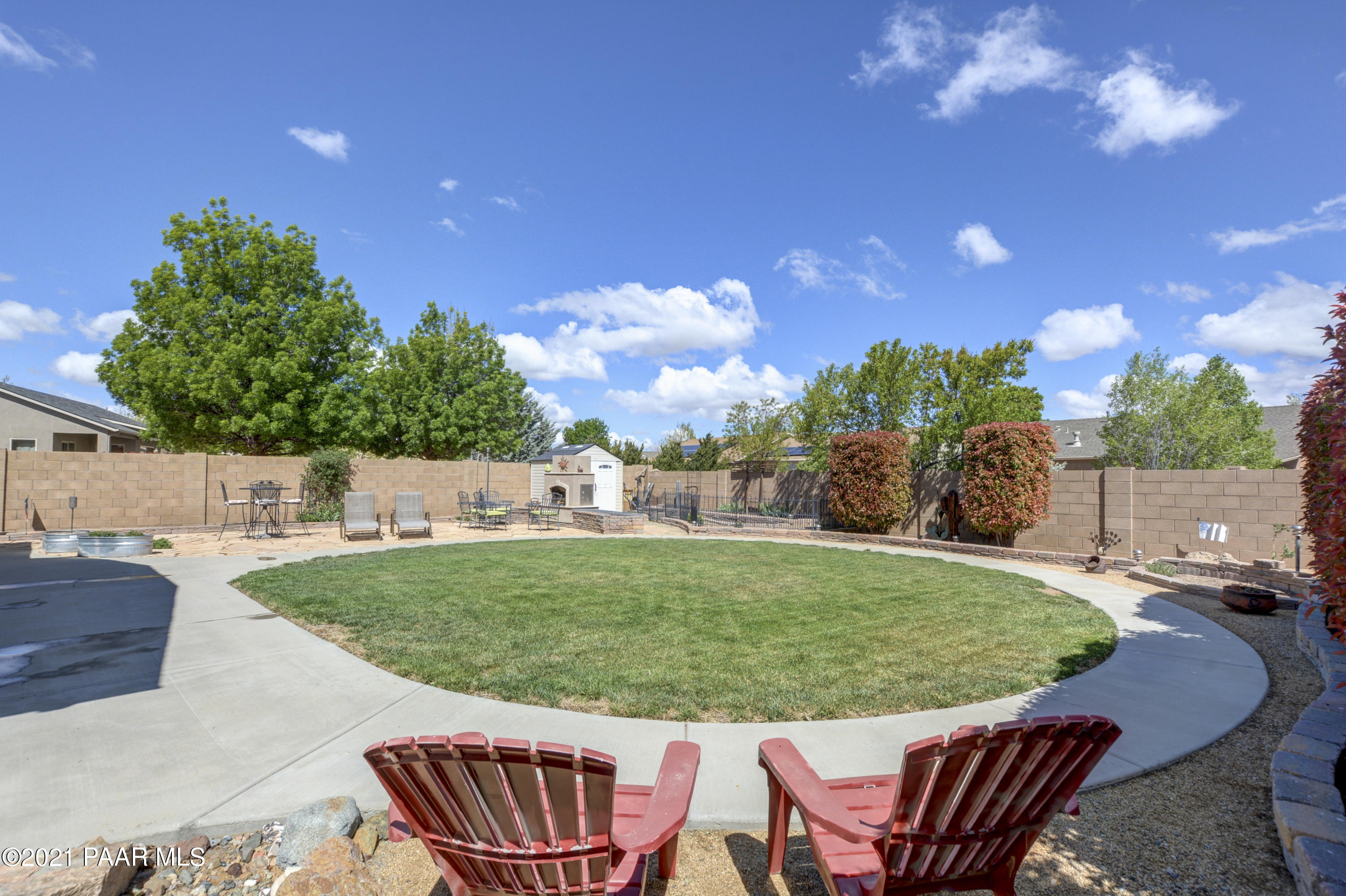 6582 Farmstead Road, Unit 3 Prescott Valley, AZ 86314 - Photo 27 of 41 a view of a swimming pool and lounge chairs