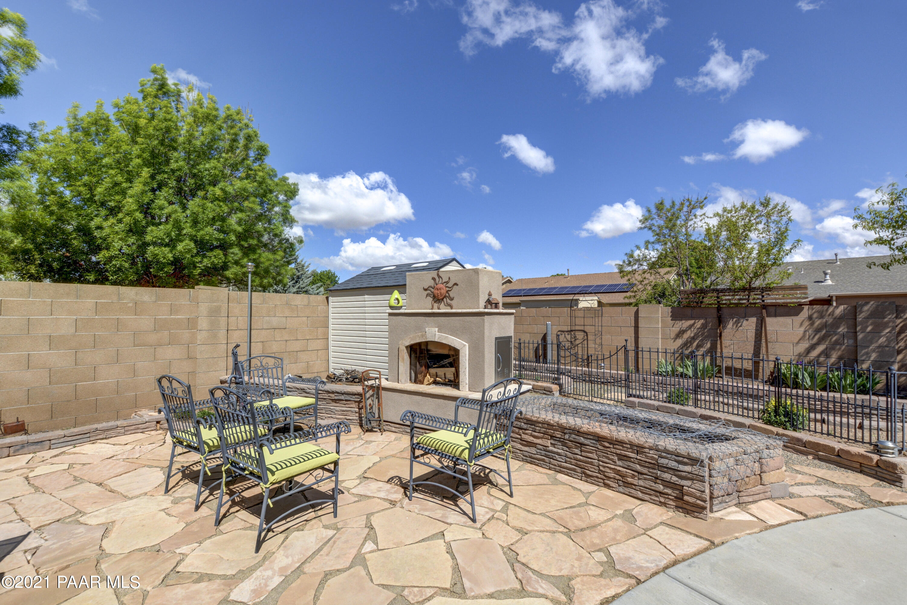 6582 Farmstead Road, Unit 3 Prescott Valley, AZ 86314 - Photo 29 of 41 a view of a backyard with sitting area and furniture