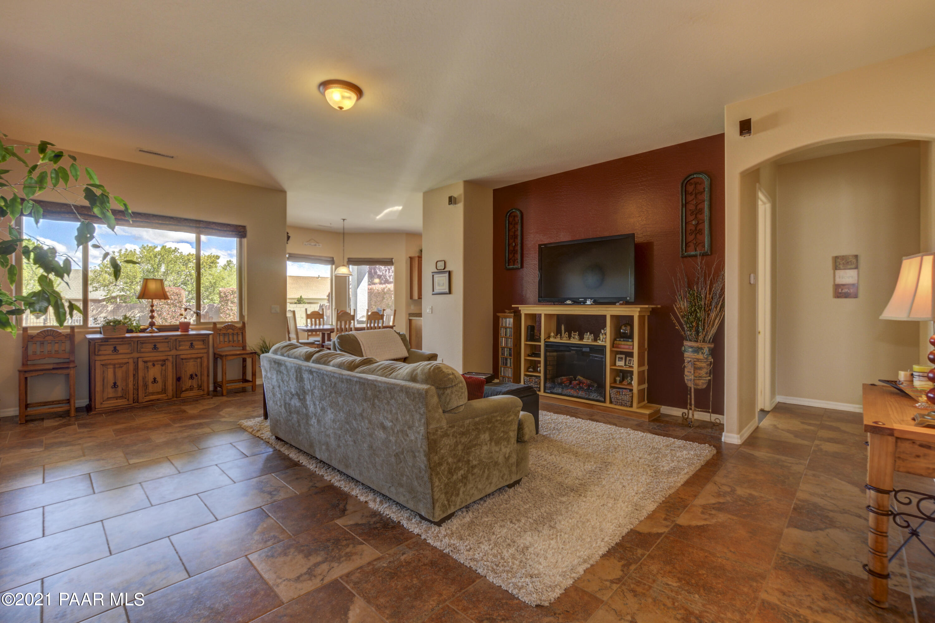 6582 Farmstead Road, Unit 3 Prescott Valley, AZ 86314 - Photo 5 of 41 a living room with furniture and a flat screen tv